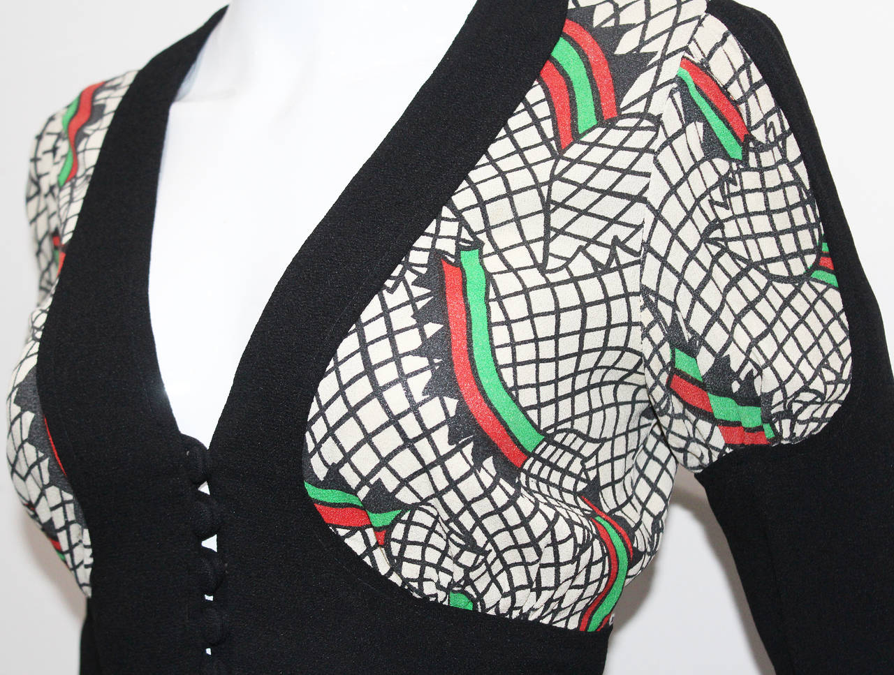 A rare Ossie Clark cropped blouse with 'Step by Step' print by Celia Birtwell, mid 1970s.

Size: Eu 38 / UK 10 / US 8