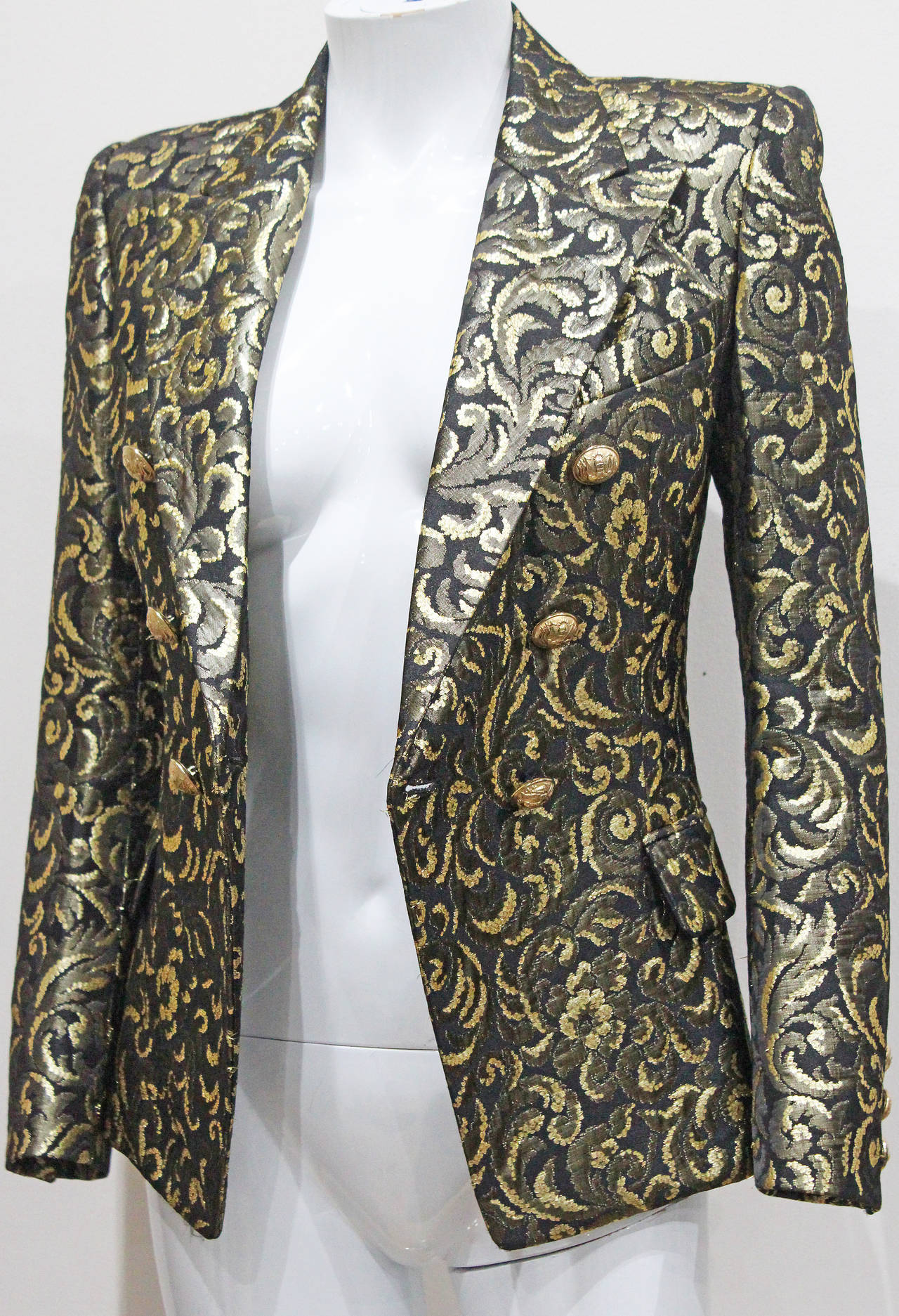 A rare and highly sought after Balmain evening blazer from the Fall 2010 runway collection, designed by Christophe Decarnin. The blazer is in a high quality jacquard fabric with gold-tone metal thread. 

The jacket is like new/unworn and comes