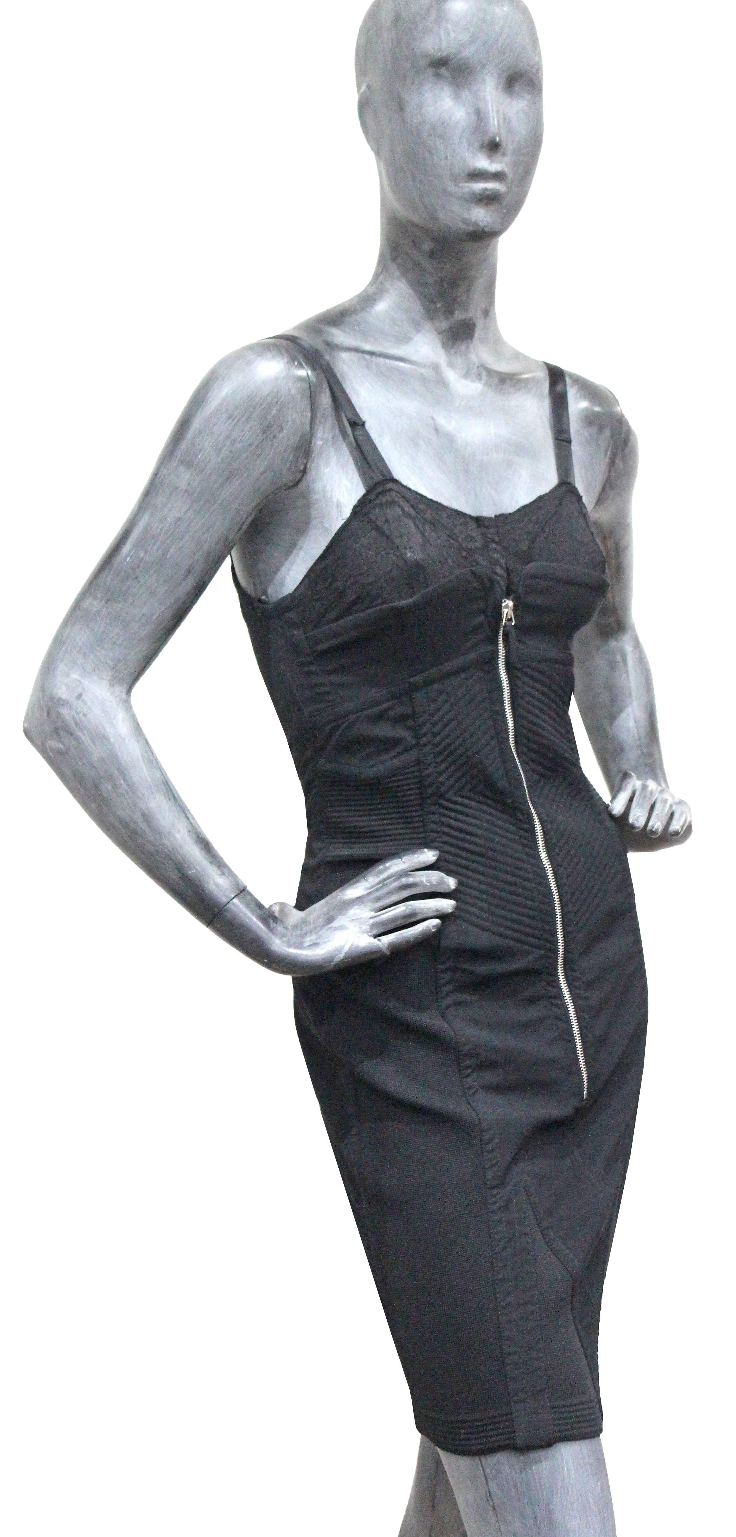 Iconic Jean Paul Gaultier lingerie style corset dress in black cotton and satin with a lace semi sheer bra and metal zipper at front. The dress has all its original tags and has never been worn.

Sizing: Fr 34 / GB 6 / XS - Small

The fabric has