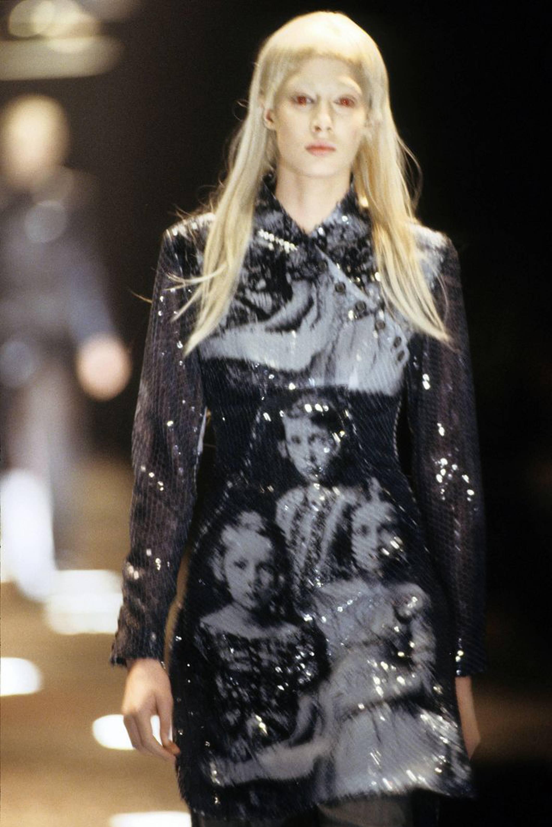 An important and highly sought after Alexander McQueen sequinned dress from the 'Joan' collection, Autumn/Winter 1998. The dress is cut in a Chinese cheongsam-style with diagonal bodice button opening and side slits to the skirt. The dress is