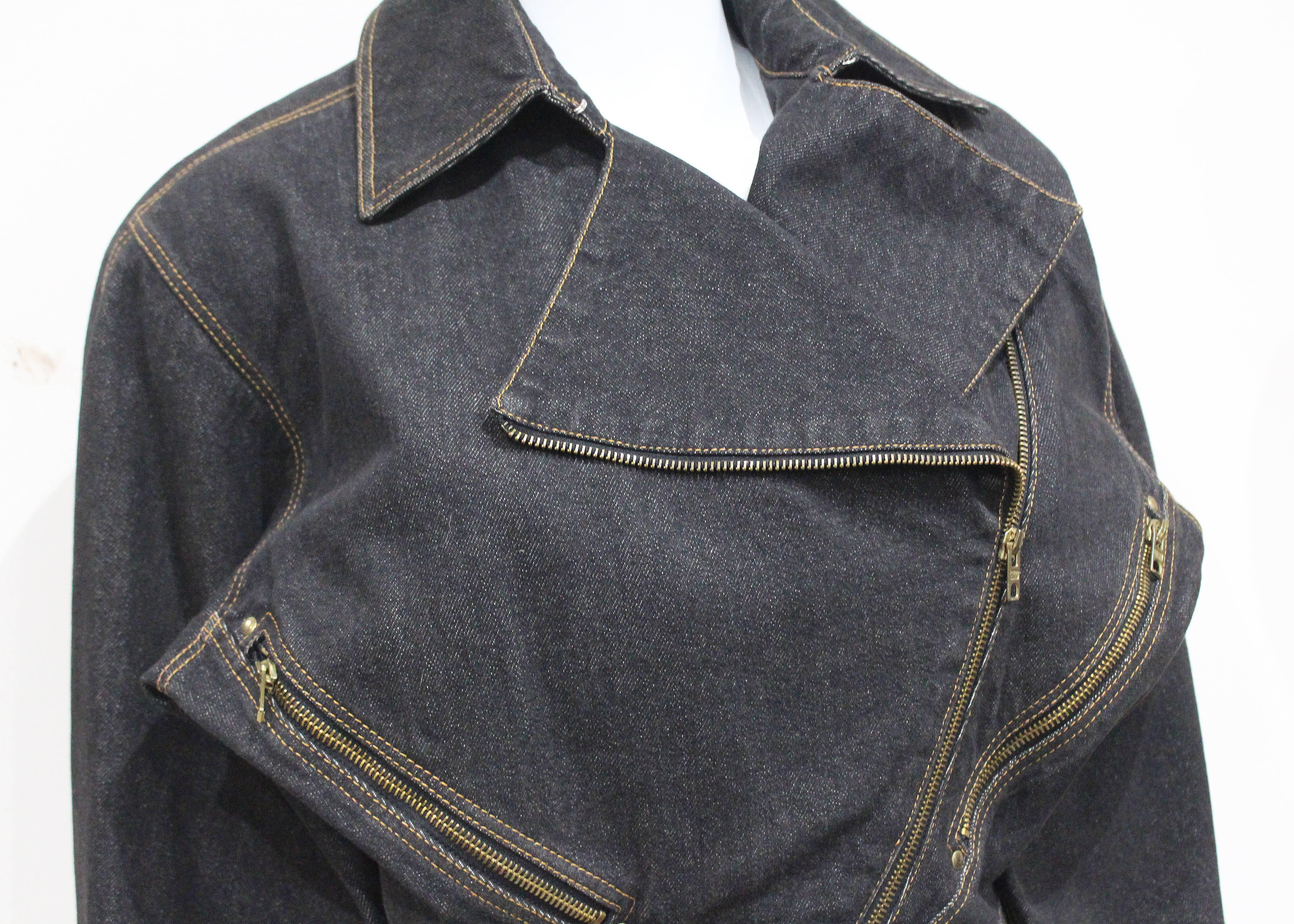 An Alaia motorcycle jacket from the 1980s, in a stone-wash grey denim.

Size: fr 40
Shoulder to shoulder - 18"
Length - 22"
Waist- 28"
Sleeve length - 21" 
Bust - 21"