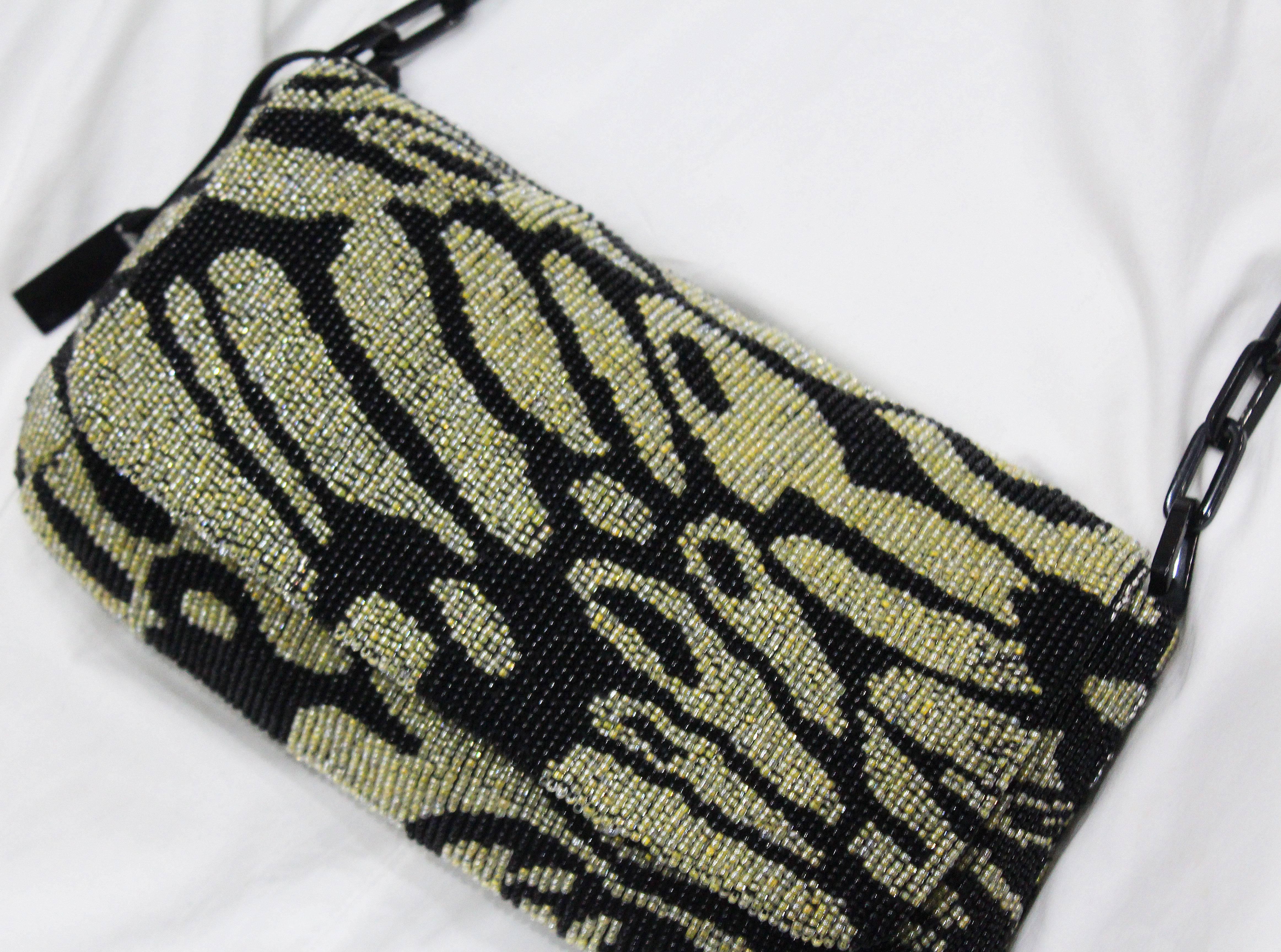 A Tom Ford for Gucci beaded evening bag from the Spring/Summer 2000 season. The bag has a linked chain shoulder strap and black silk lining. 