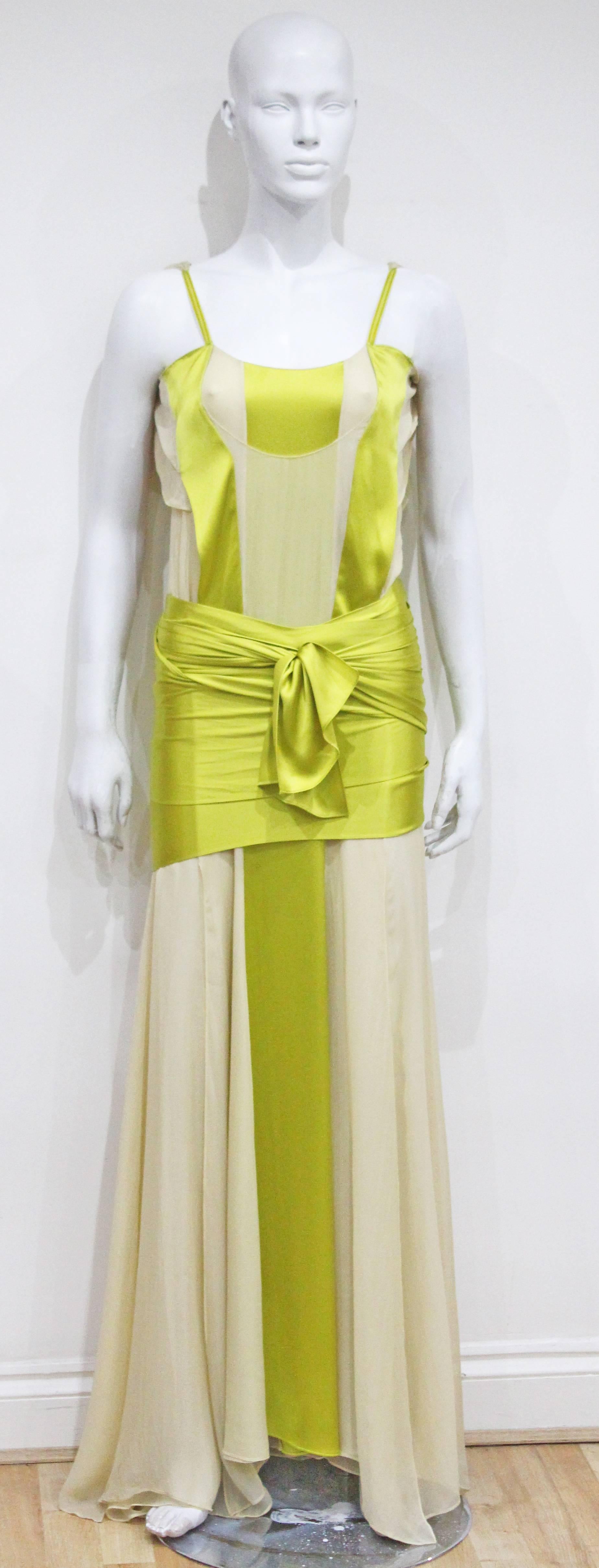 A Yves Saint Laurent by Tom Ford evening dress from the Spring/Summer 2004 runway collection. The dress is in a Grecian style with extra long silk sashes which tie around the lower waist. This particular dress was highly documented at the time and