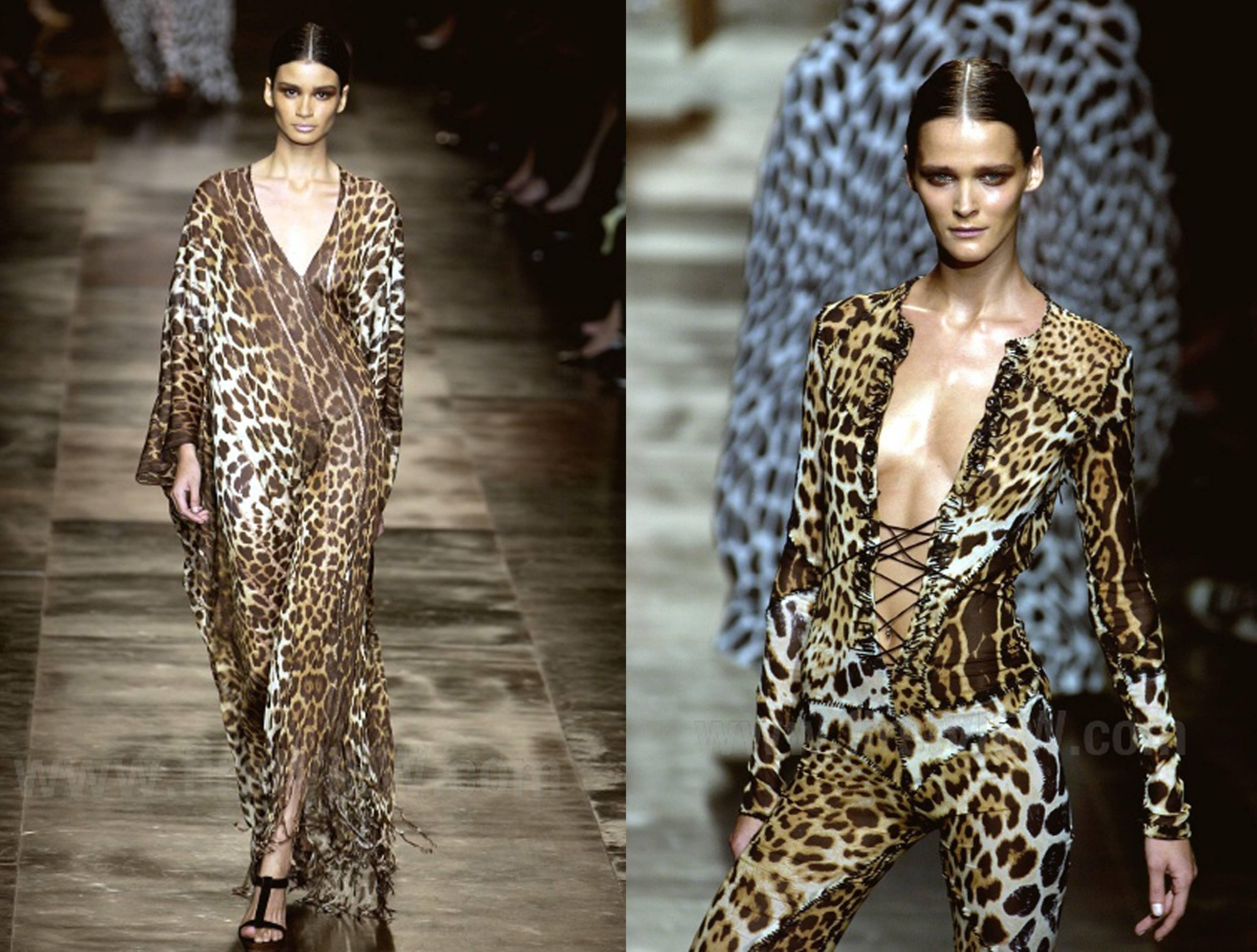 A Yves Saint Laurent leopard print caftan in leopard print, designed by Tom Ford for the Spring/Summer 2002 season. The caftan has pleating around the scoop neck line and a button closure at the rear. There is a slight train at the back giving the