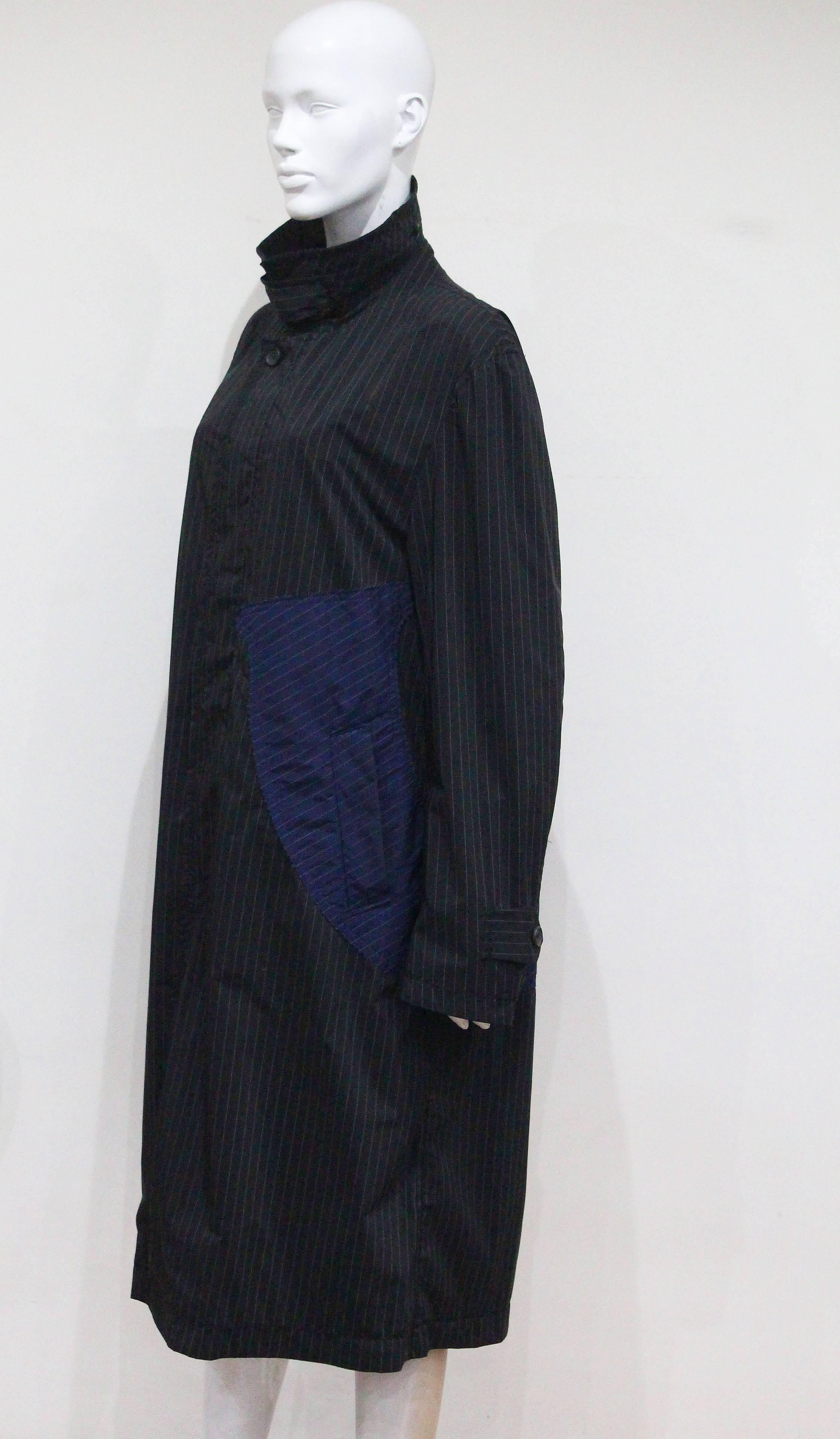 Black Issey Miyake pinstripe windbreaker coat, c. 1990s