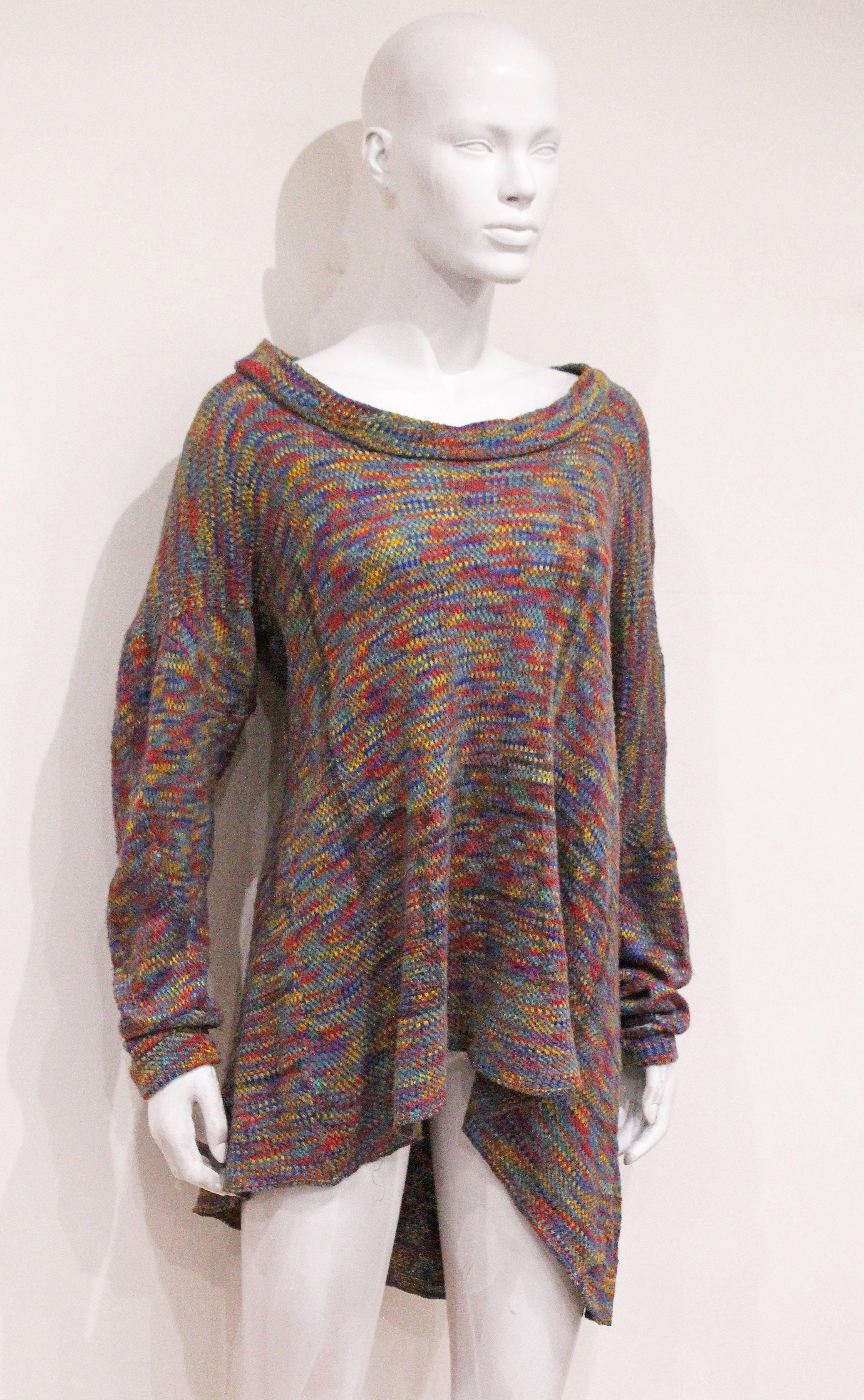 A fine and rare 'buffalo' jumper from the Nostalgia of Mud boutique by Vivienne Westwood and Malcolm McLaren. The jumper is in a multicoloured knit and is cut asymmetrically. 

M/L 