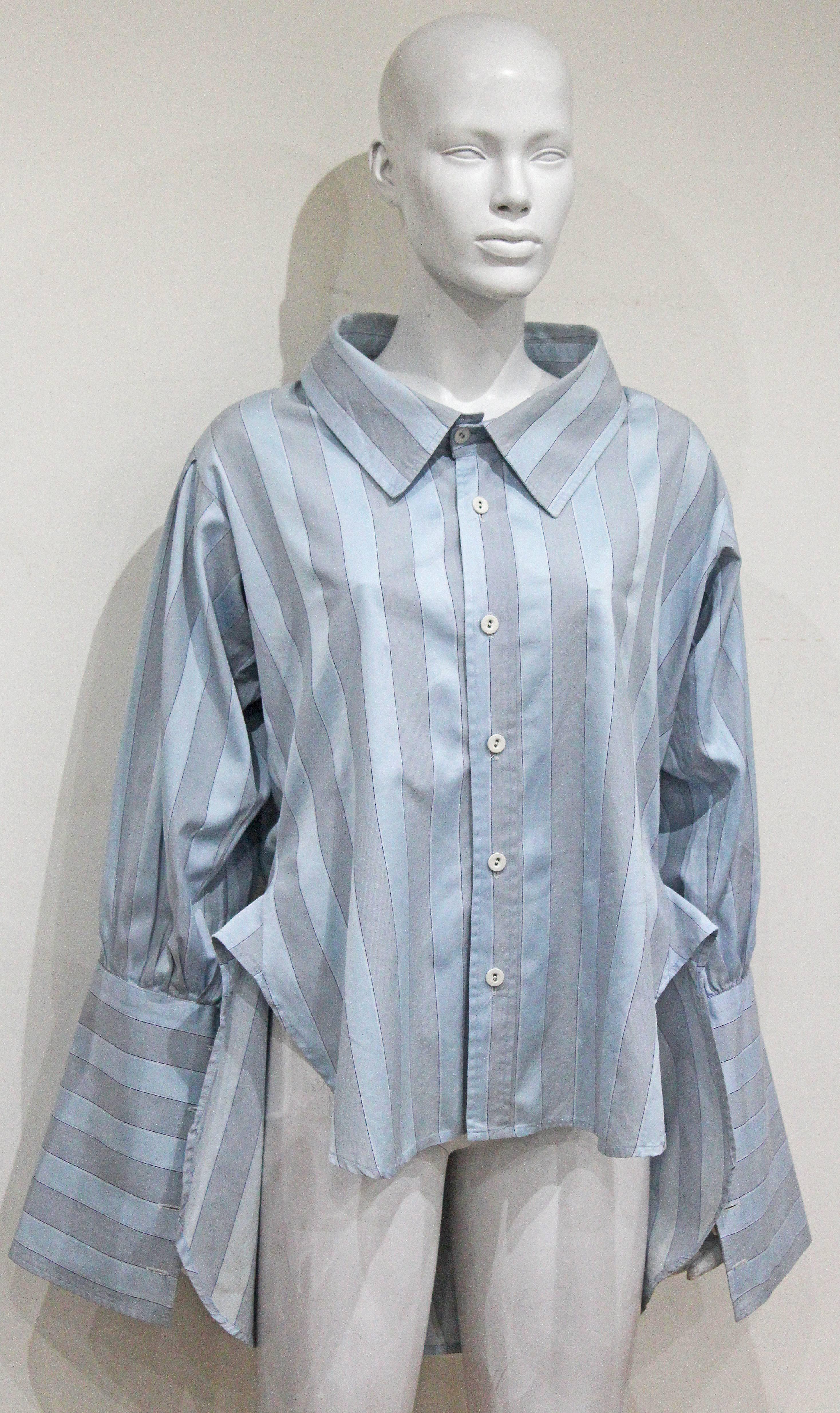 An oversized striped pirate shirt by Vivienne Westwood and Malcolm McLaren, circa 1981. The shirt has huge cuffs and has a long back and short front. 

S/M