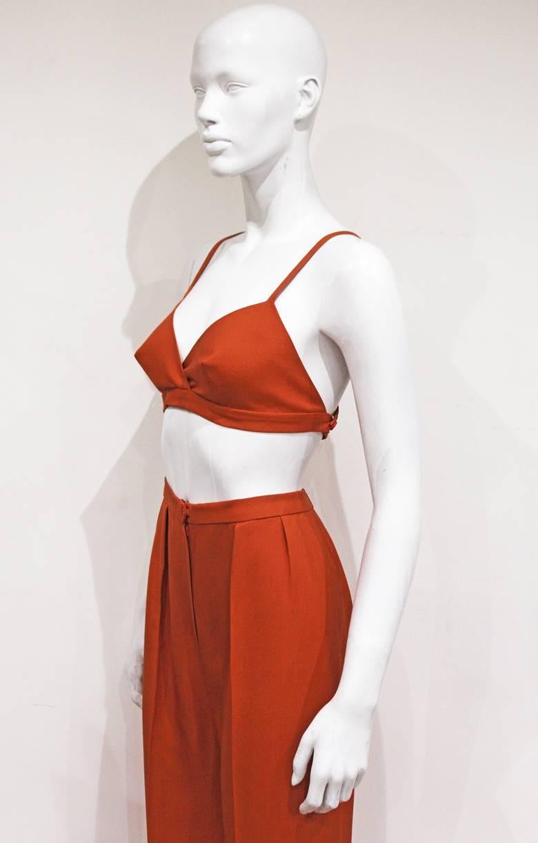 Red Christian Dior burnt orange raw silk pant suit with cone bra, c. 1950s