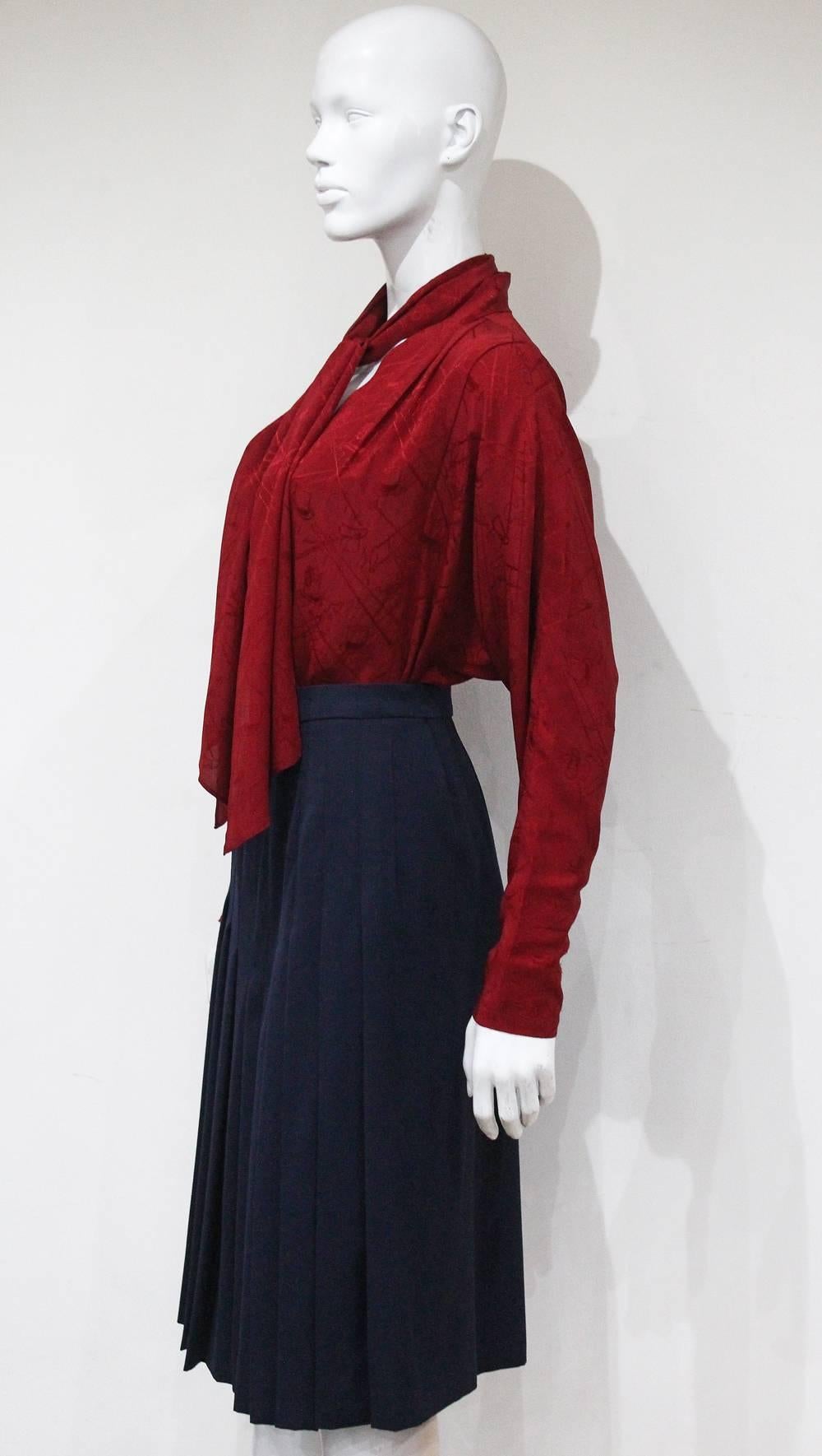 Black Hermes pleated skirt and silk blouse ensemble, c. 1970s