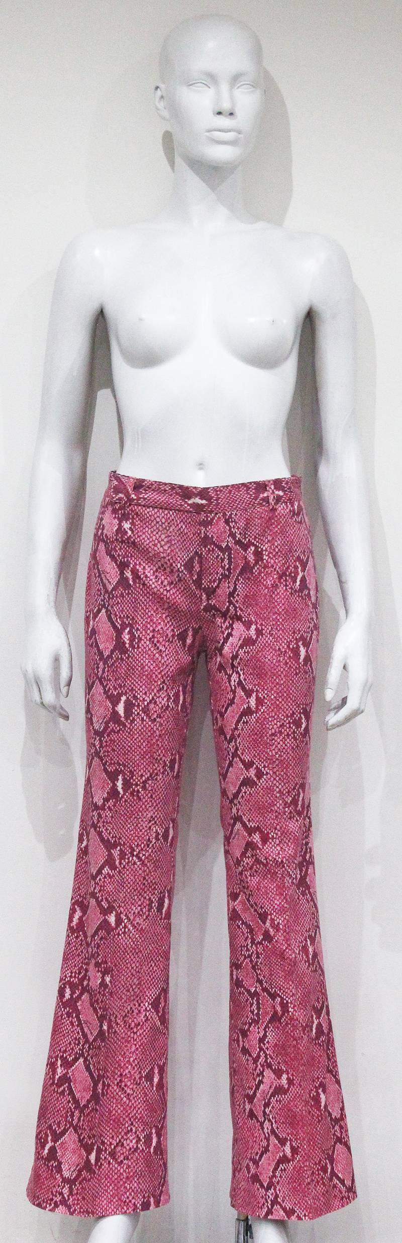 A pair of bell bottom pants by Tom Ford for Gucci from the Spring/Summer 2000 runway collection. The pants are in a hot pink python print and 100% cotton. 

It 38 - Fr 34 
