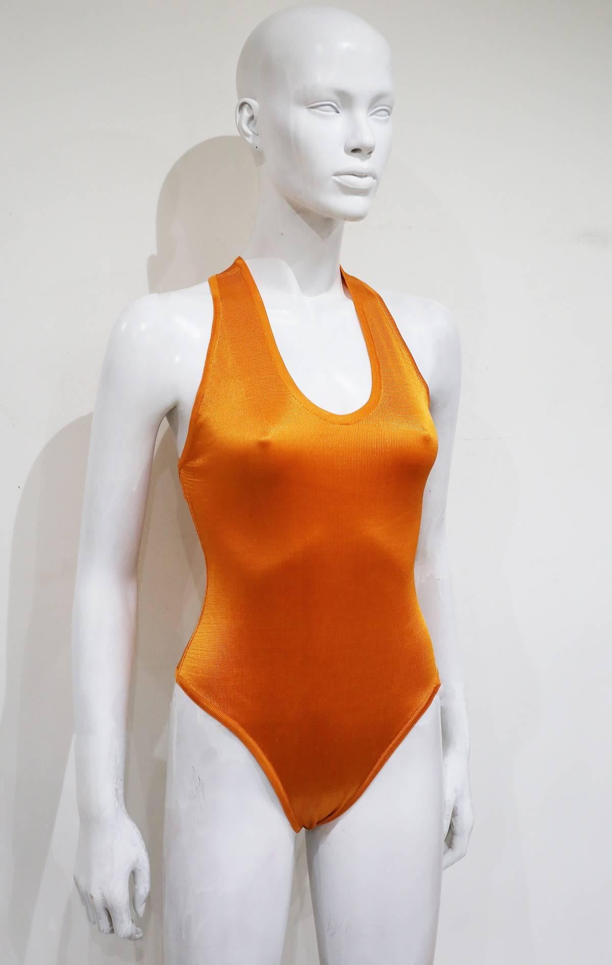 Circa 1990s Alaia knitted bodysuit with a cross over straps at the rear and snap button closures. 

Size Small 

Would look great styled under a skirt or jeans 