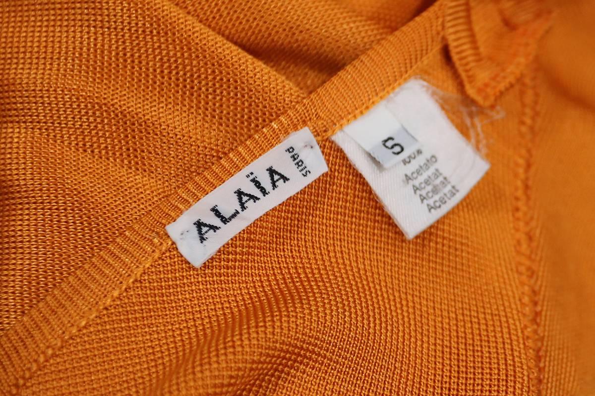 Alaia knitted orange bodysuit with cross over back, c. 1990s 1