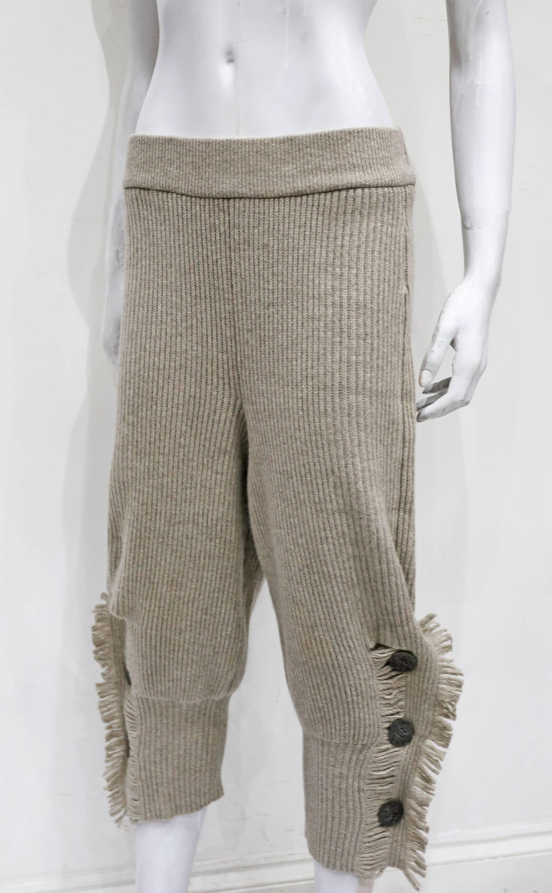 Early and rare Issey Miyake rib knit cropped pants from the 1980s. Fringed seams with three button closure on each leg. 

Size: S