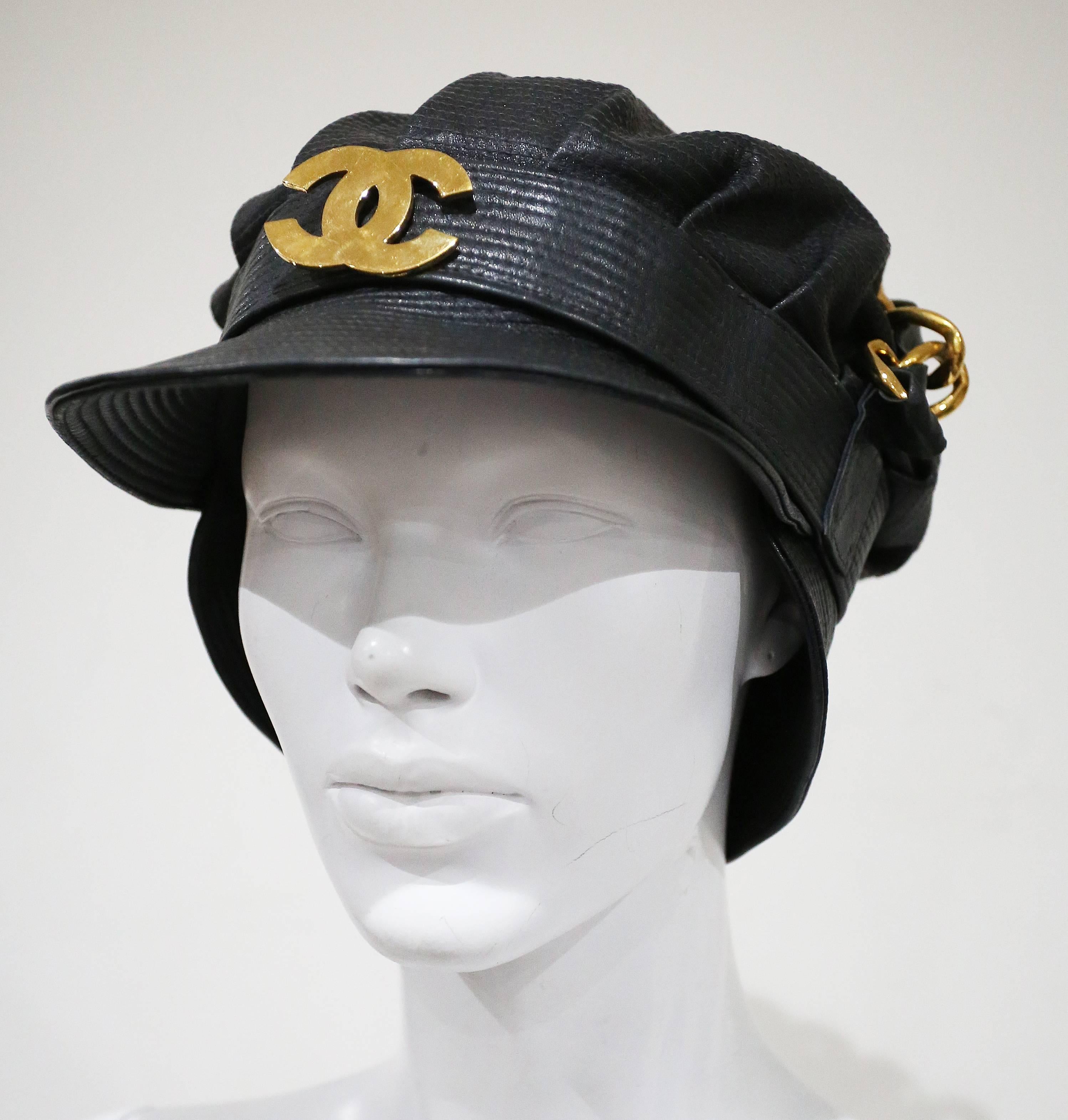 Rare and iconic Karl Lagerfeld for Chanel biker cap, circa 1992. The hat features an extra large chain on top and Chanel 'CC' logo on front. The hat was worn by supermodel Kristen McMenamy for Vogue Italia, May 1992, photographed by Steven