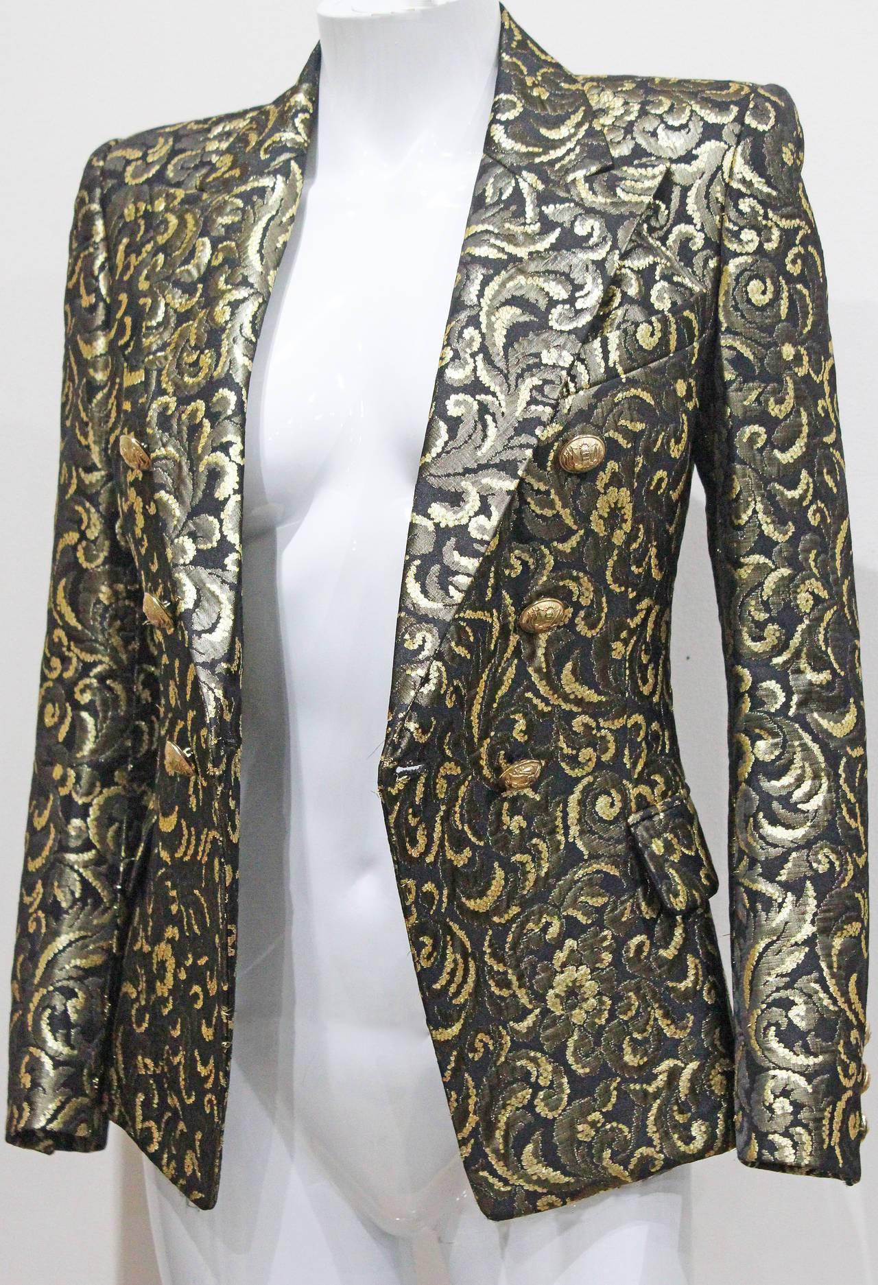 A rare and highly sought after Balmain evening blazer from the Fall 2010 runway collection, designed by Christophe Decarnin. The blazer is in a high quality jacquard fabric with gold-tone lame thread.  

 French 36 / UK 8 / Italy 40 