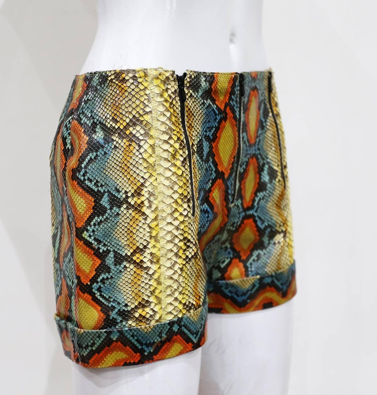 A pair of python skin hot pants from the Spring-Summer 2000 collection. The pants feature black silk interior, python skin a beautiful exotic colours and three zip closures. 

