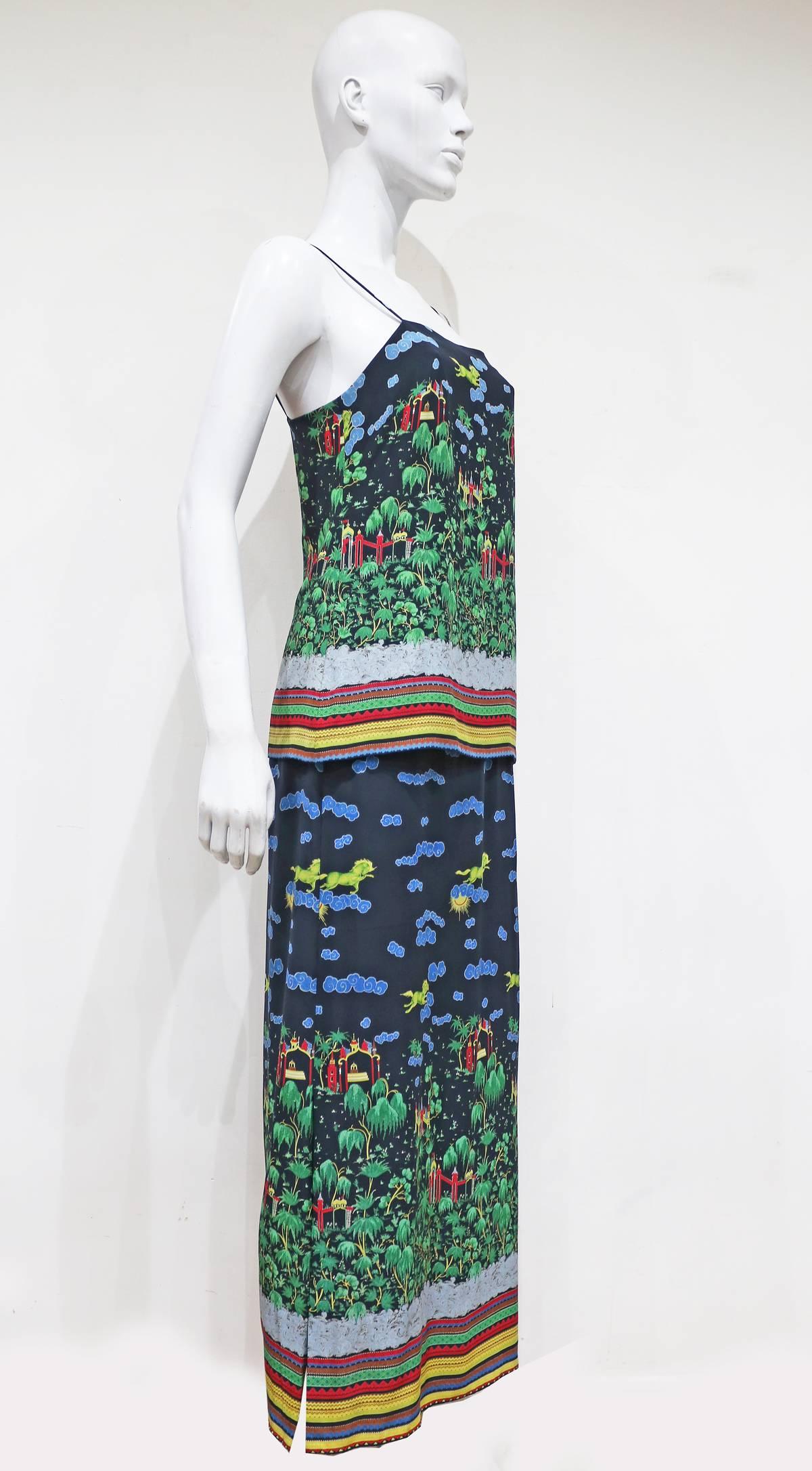 A beautiful silk summer dress by Murray Arbeid London, the dress features an illustration Oriental print throughout. 

Murray Arbeid was a British fashion designer, known for his evening wear. His notable clients included Princess Diana and