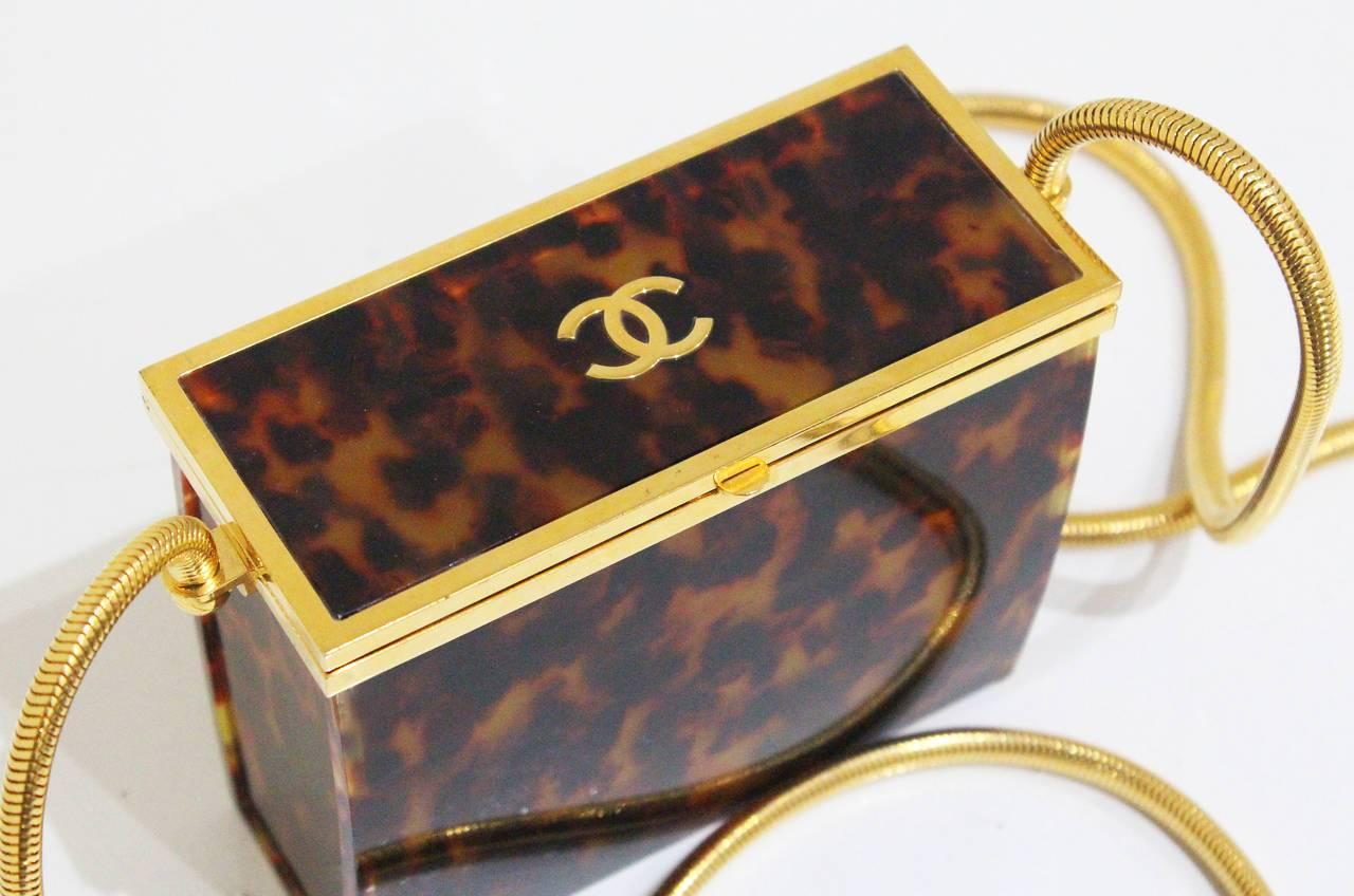 Incredibly rare and unique Chanel tortoise shell evening box bag. The bag has a gold 'CC' Chanel logo on the top, snap closure and 'Chanel '97' Made in France' engraved inside. These bags are rare and hard to find as only a limited amount were