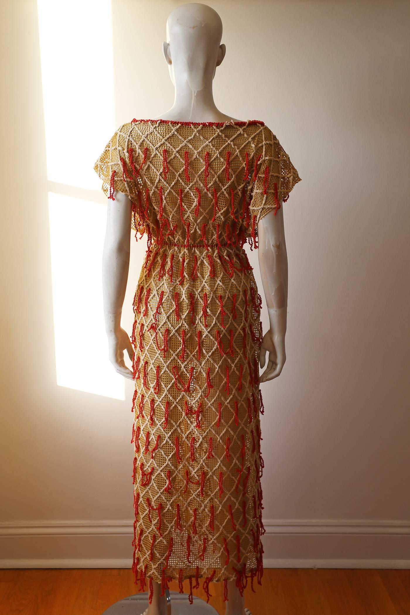 Brown Embroidered netted dress with tassels, c. 1970