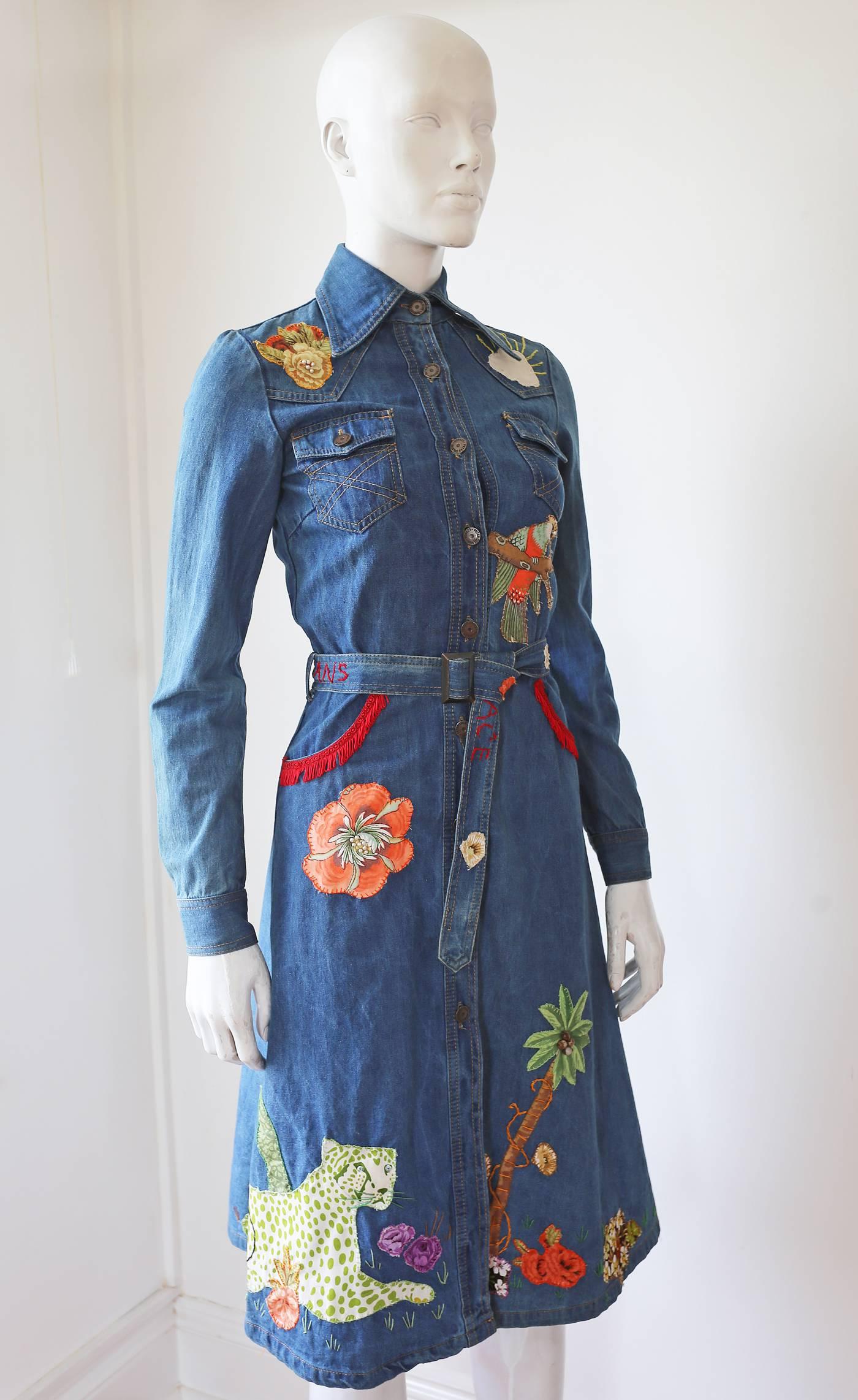 Extremely rare and collectible Peter Golding denim dress from the ACE store on London's King's Road Chelsea in 1974. The dress features, western style fringed pockets, hand sewn patchwork jungle themed imagery all over and embroidered 'ACE JUNGLE