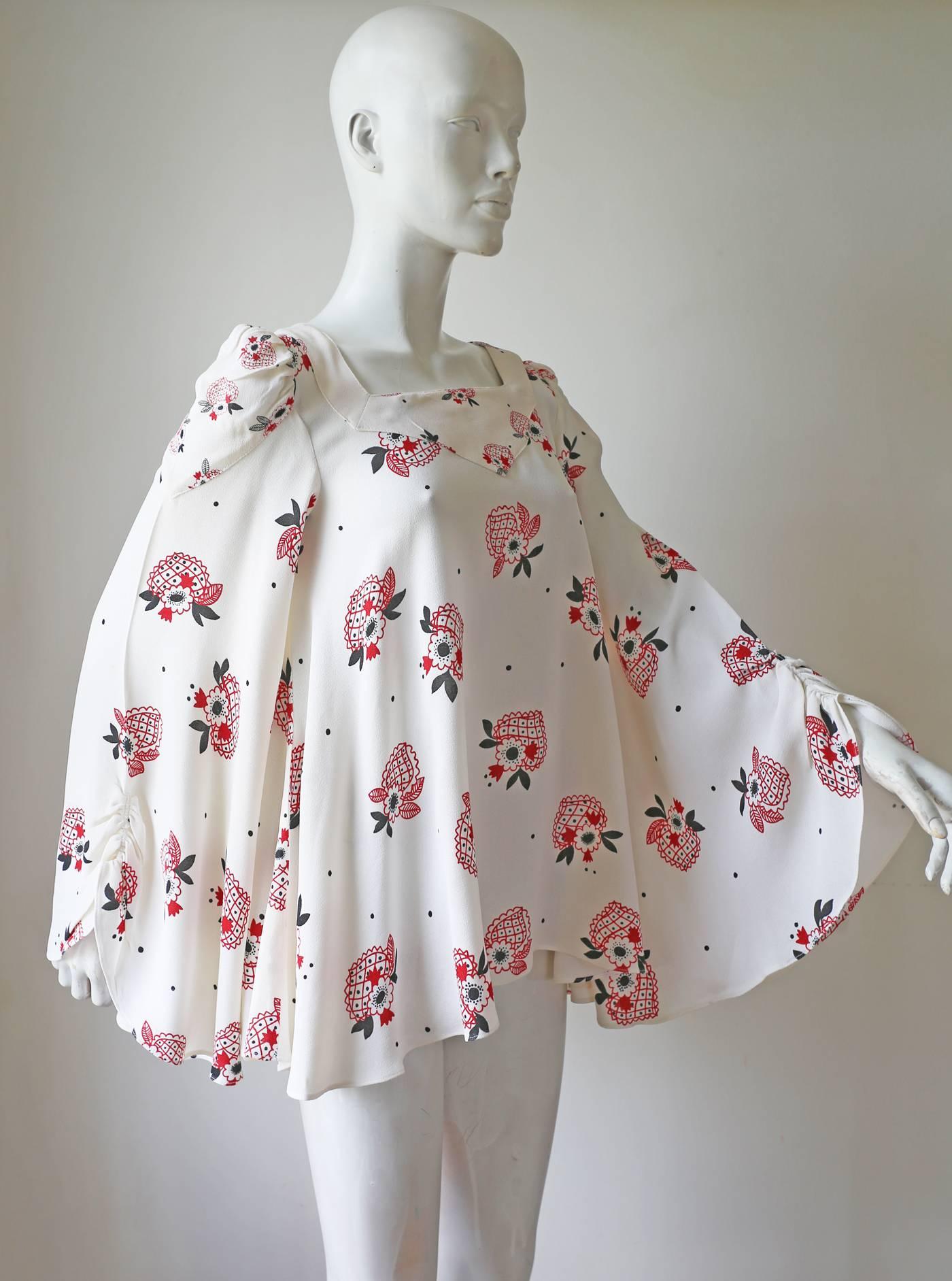 A beautiful Ossie Clark blouse with a Celia Birtwell print and huge ruched bell sleeves.

Small