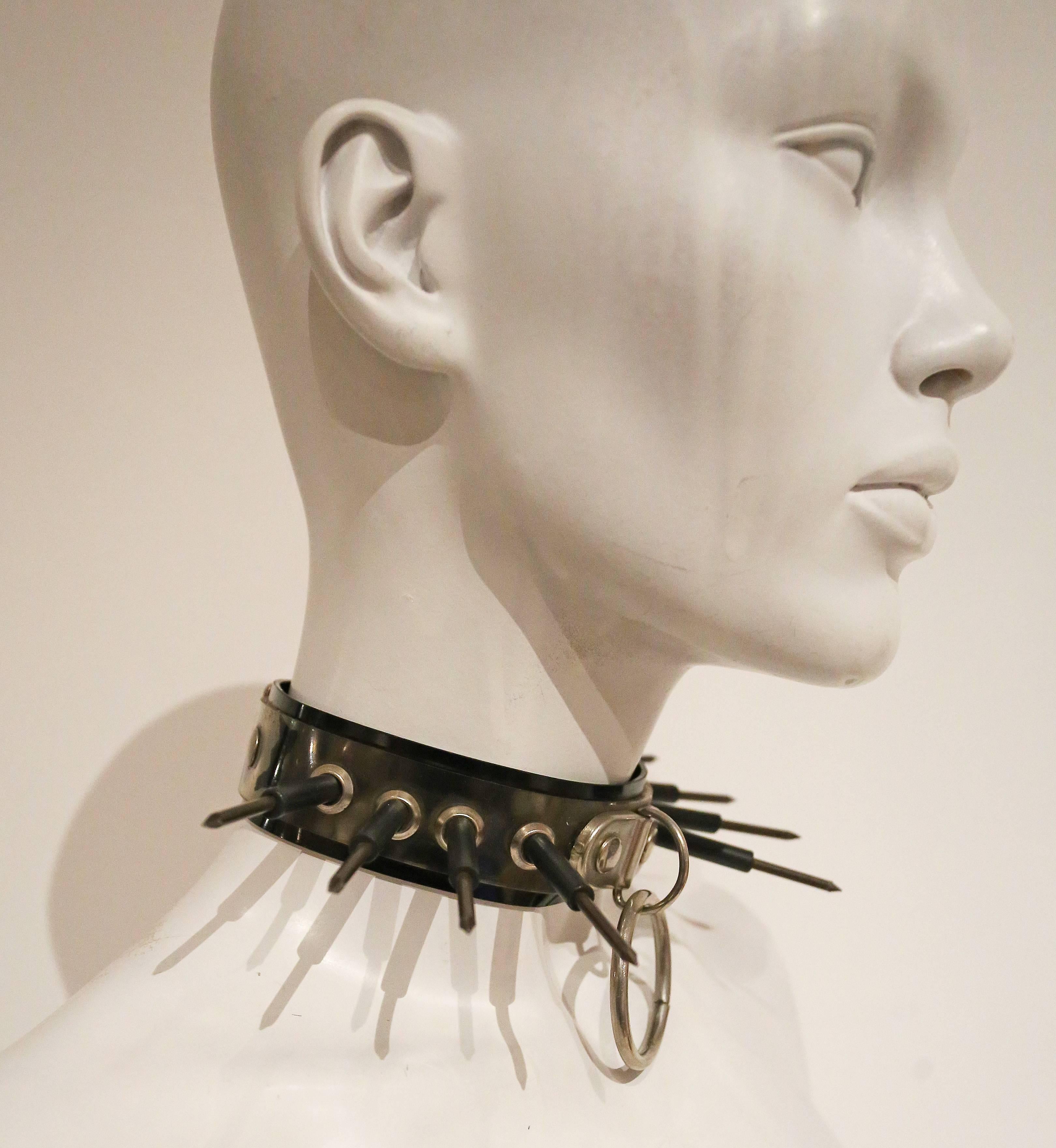 Original 1970s punk choker from London. The choker features metal screws, metal ring and vinyl.

