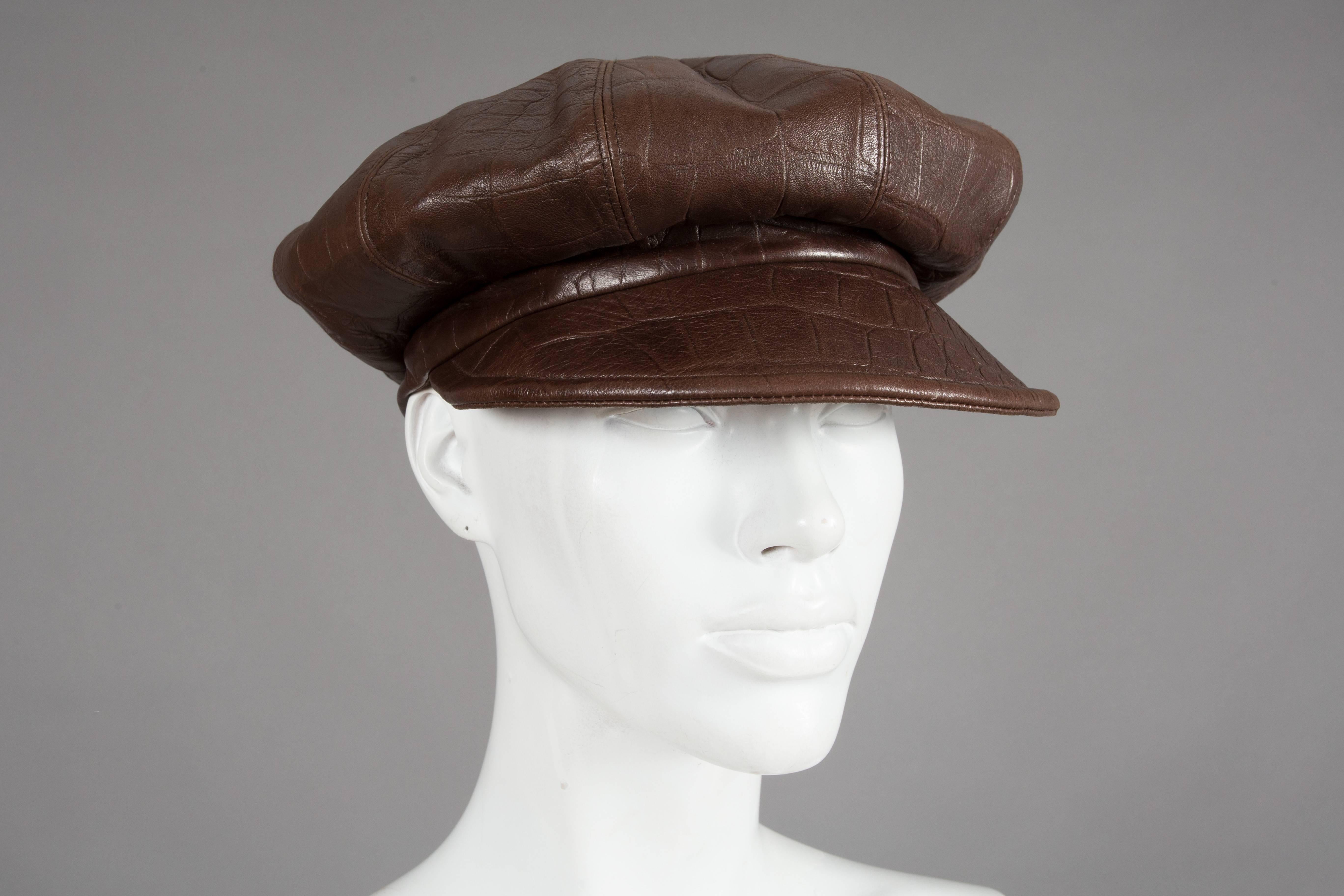 Rare Christian Dior by John Galliano brown crocodile embossed leather newsboy cap, RTW autumn-winter 2005 collection. The cap features a soft top, button at centre top, metal 'Dior' plate at rear and monogram lining. 

Size 58