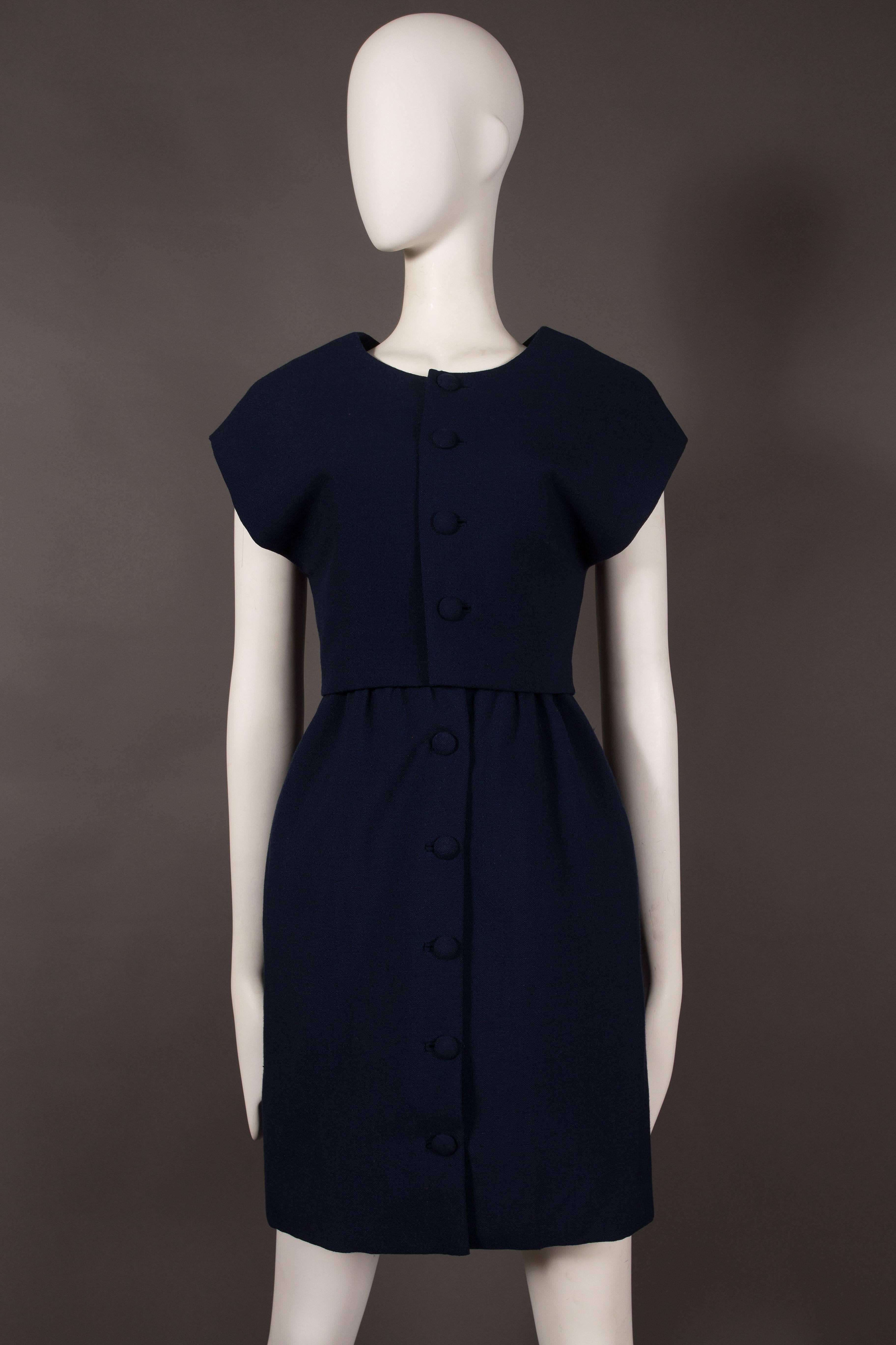 A fine and rare Balenciaga Haute Couture dress suit, designed under the 'EISA' label, circa 1958-1960. 

Sleeveless cocktail dress with fabric button closures on front closure, pleated puff skirt and two hidden side pockets. 

Constructed cropped