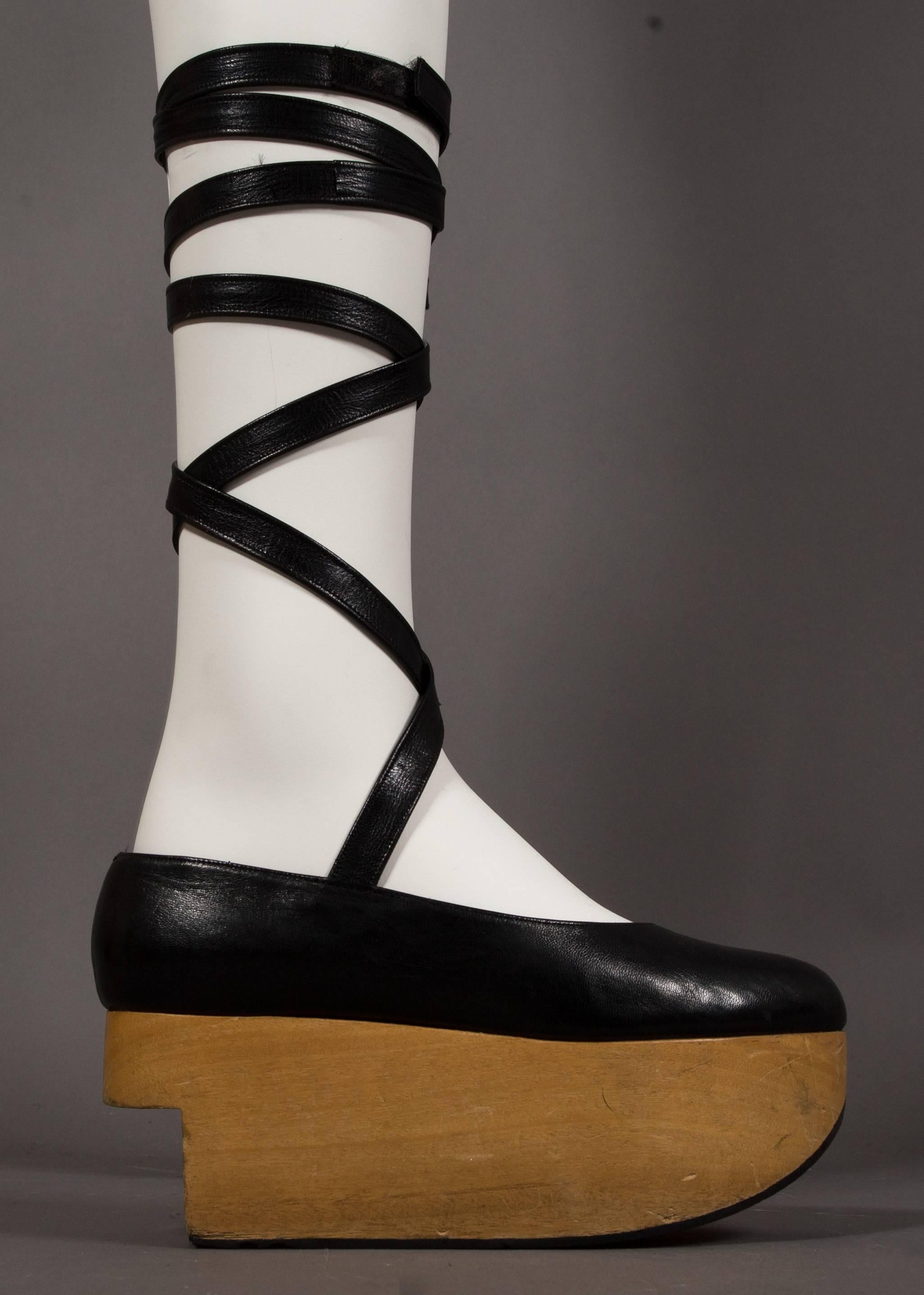 A rare pair of Vivienne Westwod black leather 'Rocking Horse' shoes with wooden platforms and extra long ankle straps, circa 1980s. 