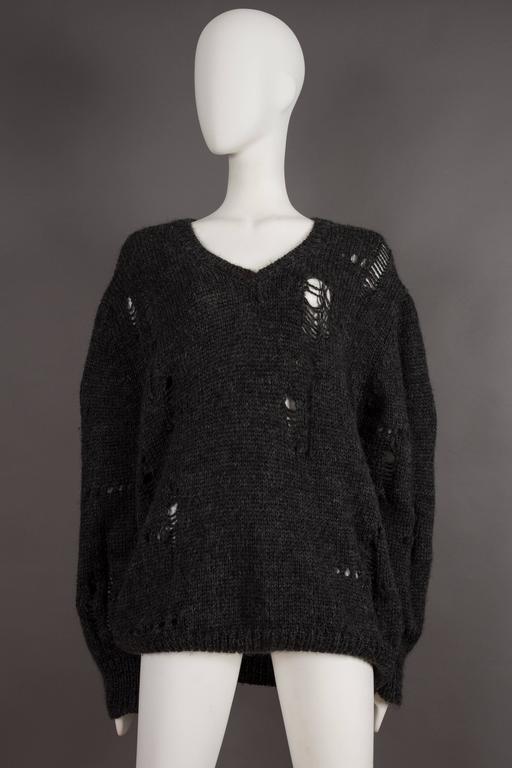 Comme des Garcons oversized sweater decorated with holes, circa