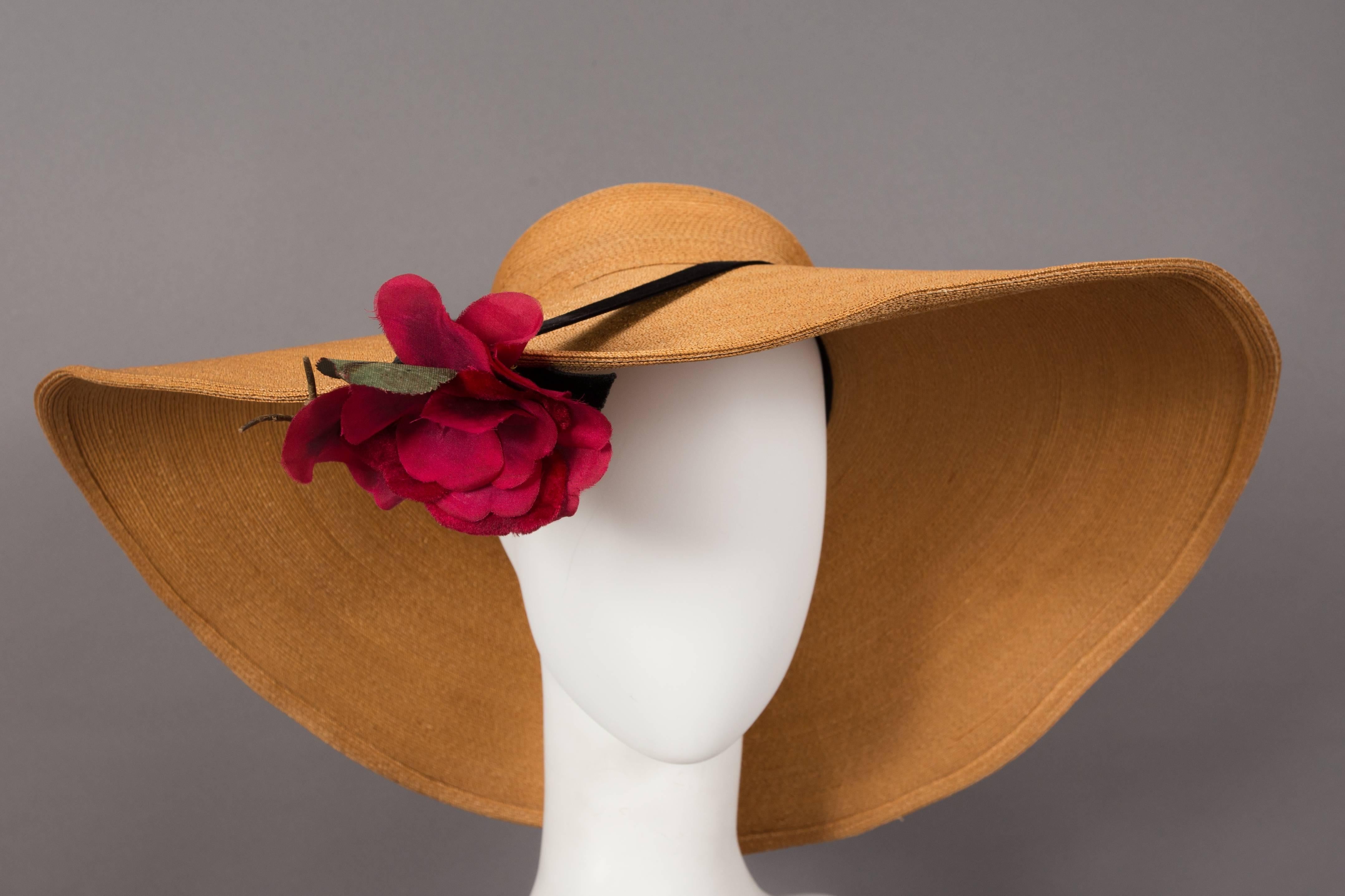 Keneth Hopkins wide brim straw sunhat, circa 1940s. 

Hopkins was Hollywood’s top milliners in the mid-late 40s and designed hats for films such as Cover Girl and Phantom Lady.

Size  56 cm / 22 inches