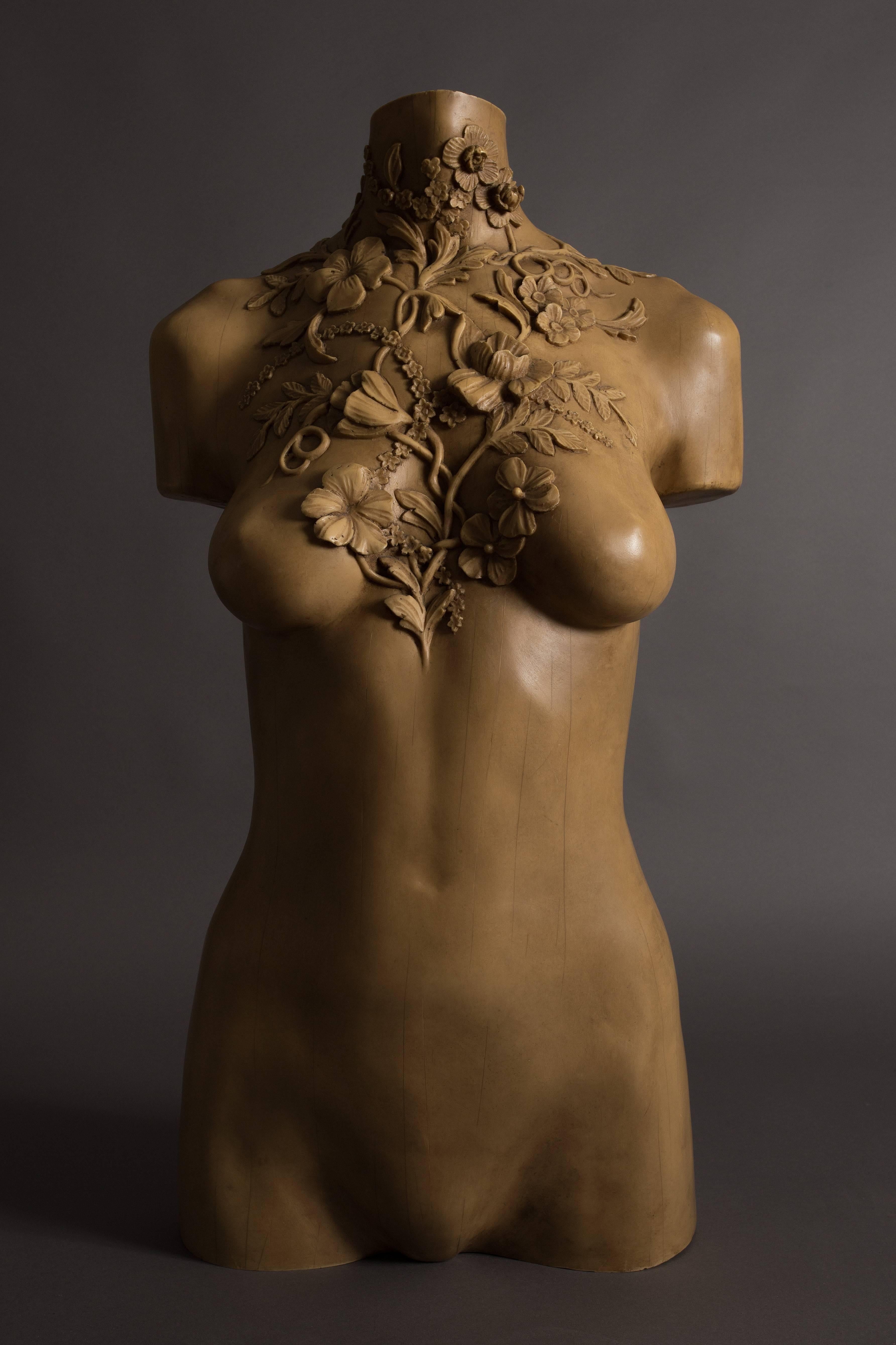 Alexander McQueen bust of Laura Morgan made in 2001, used as a decorative mannequin in the Alexander McQueen store at 47 Conduit Street, London. 

McQueen commissioned woodcarver Paul Ferguson to create two identical busts based on a mould of the