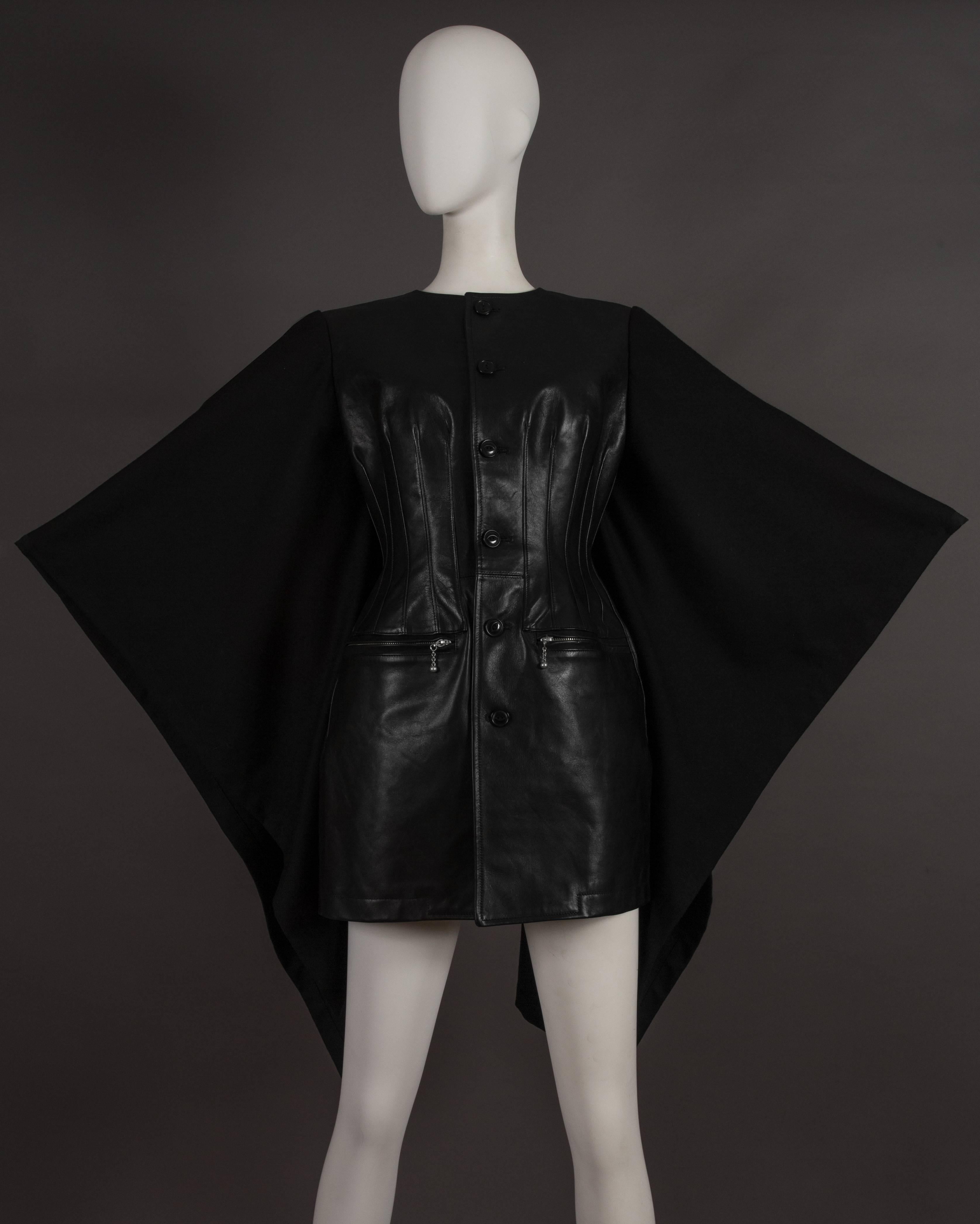 Rare Junya Watanabe COMME des GARCONS black leather jacket with attached wool cape. The jacket features a moulded leather bust with button fastenings, two zipped front pockets and cupro lining. From the autumn-winter 2011 runway collection.