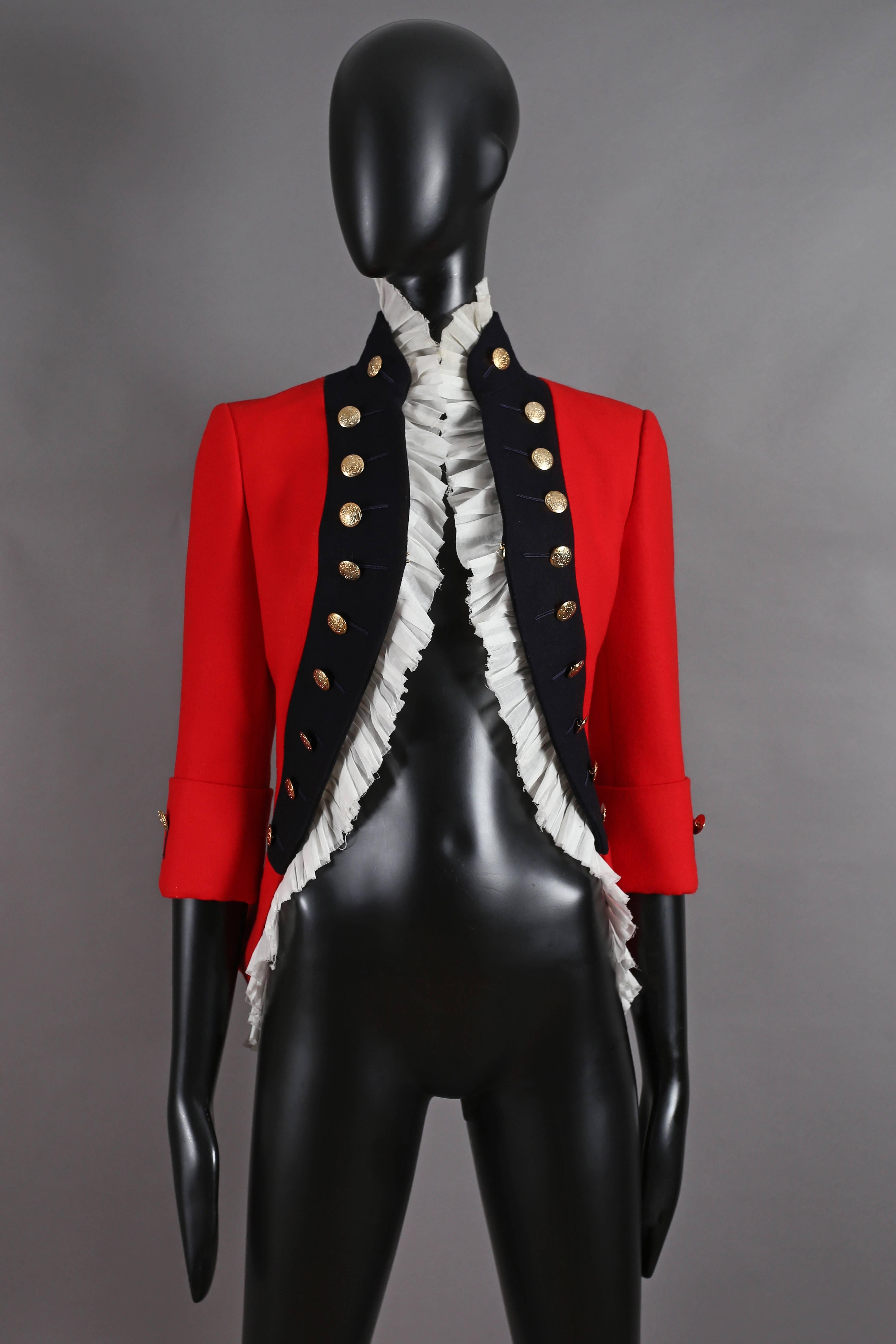 A rare Alexander McQueen matador-style jacket in red wool with pleated white cotton trim, decorative gold buttons throughout and hook-and-eye closure. 

From the Autumn-Winter 'The girl who lived in a tree' 2008. 