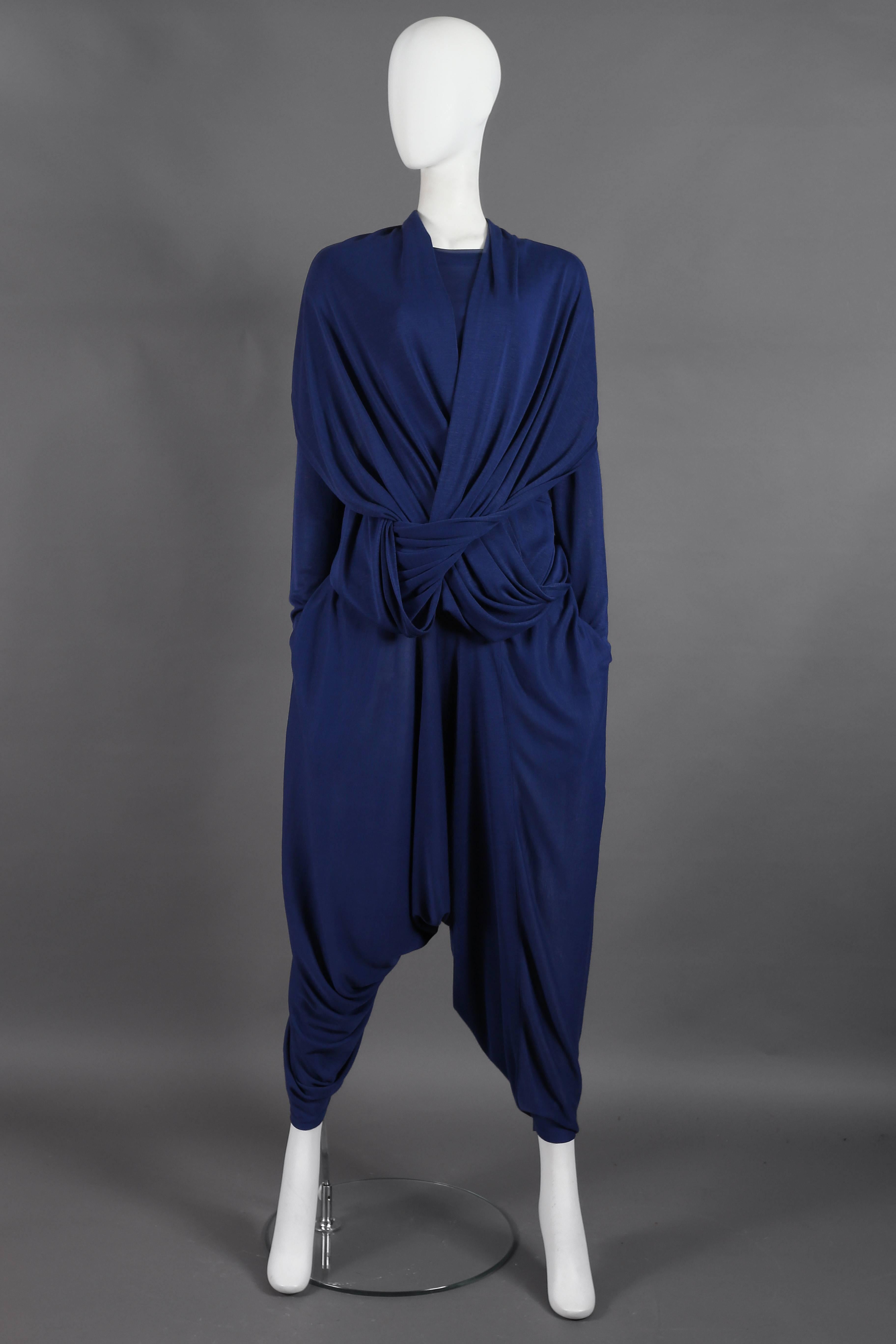 Presenting an exceptional Issey Miyake knitted 2-piece pant suit, a true treasure from the illustrious 1980s era. This unique suit showcases Issey Miyake's signature design ingenuity and artistry.

The harem-style pants exude a sense of comfort and