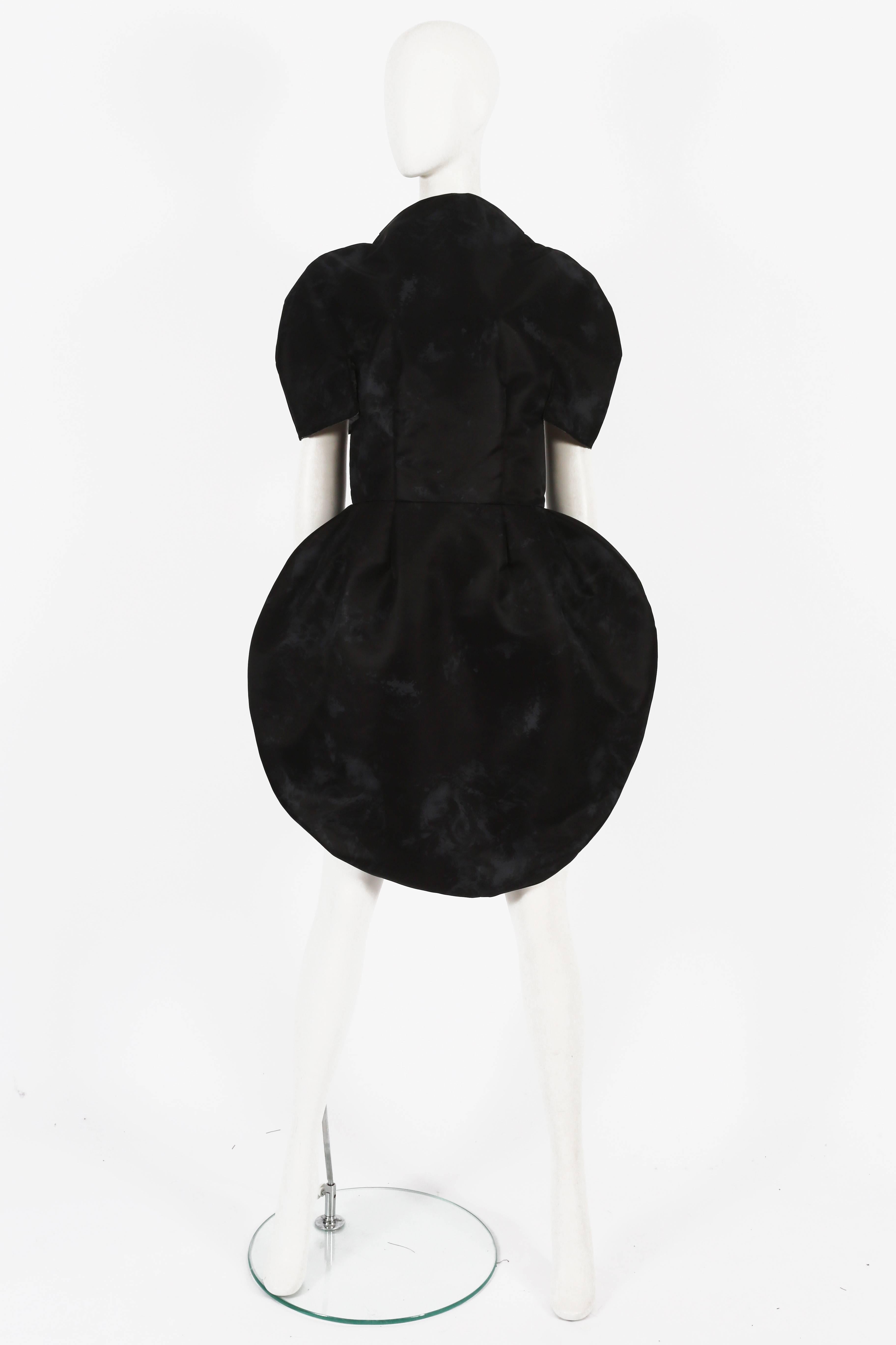 A rare Comme des Garcons 2D nylon dress from the spring summer 2009 collection.