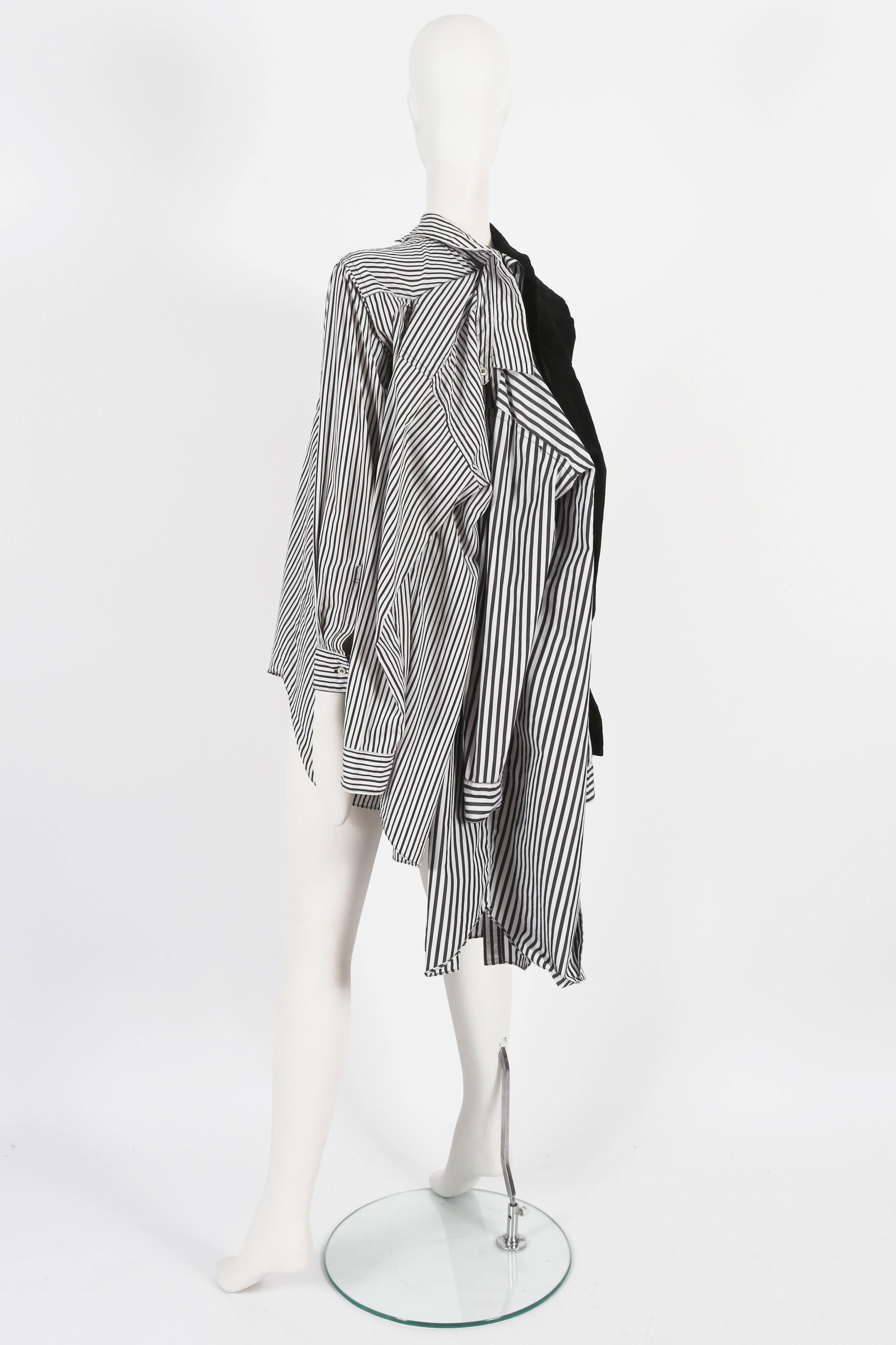 Presenting a rare Comme Des Garcons oversized deconstructed shirt from the spring-summer 2011 collection. This exceptional shirt is a true representation of the brand's avant-garde and innovative design philosophy.

Constructed from four layered