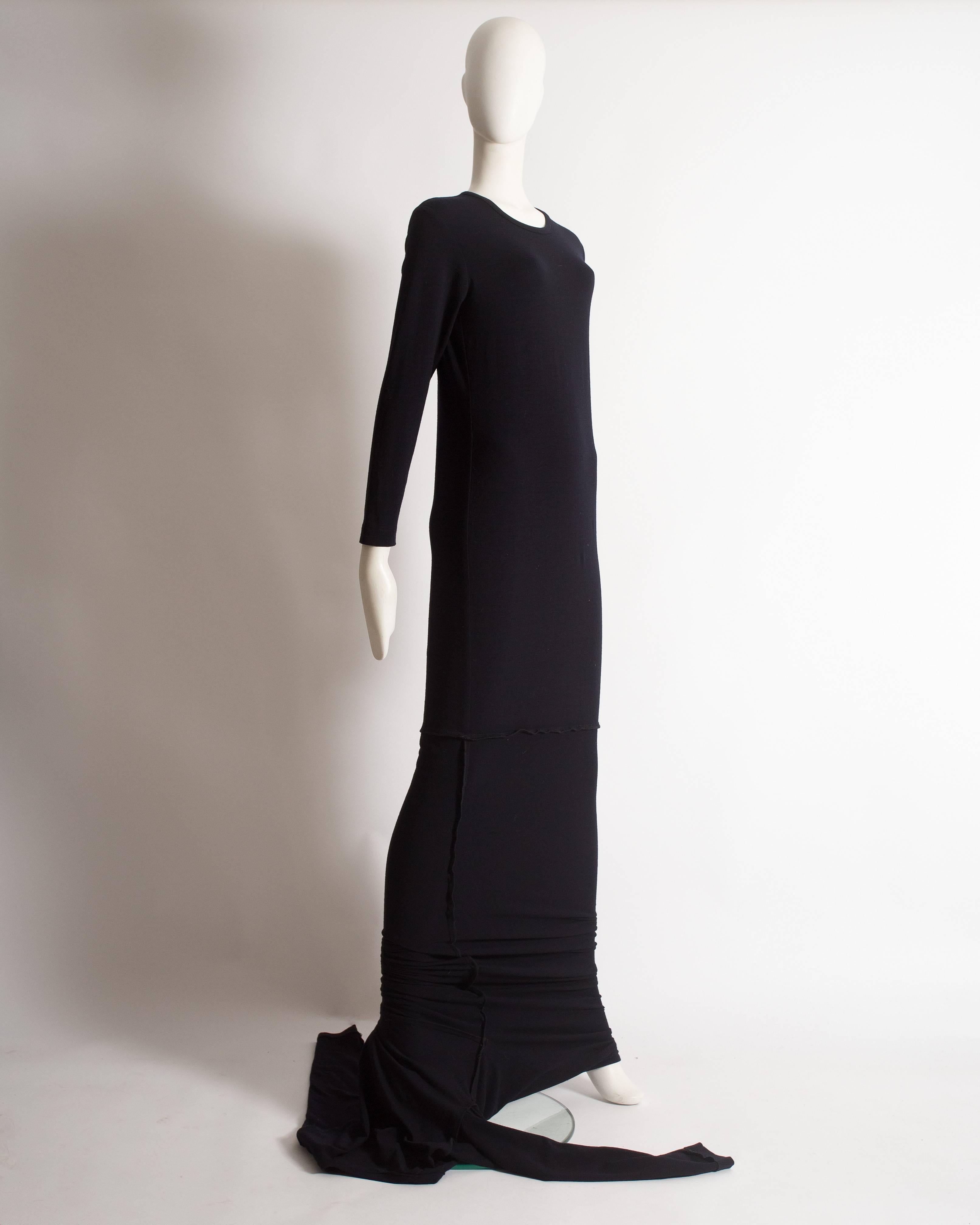 Rare Comme des Garcons extra long knitted dress constructed in black wool from the 'Punk Chic' collection, Autumn-Winter 1991. 

Medium

Excellent condition

