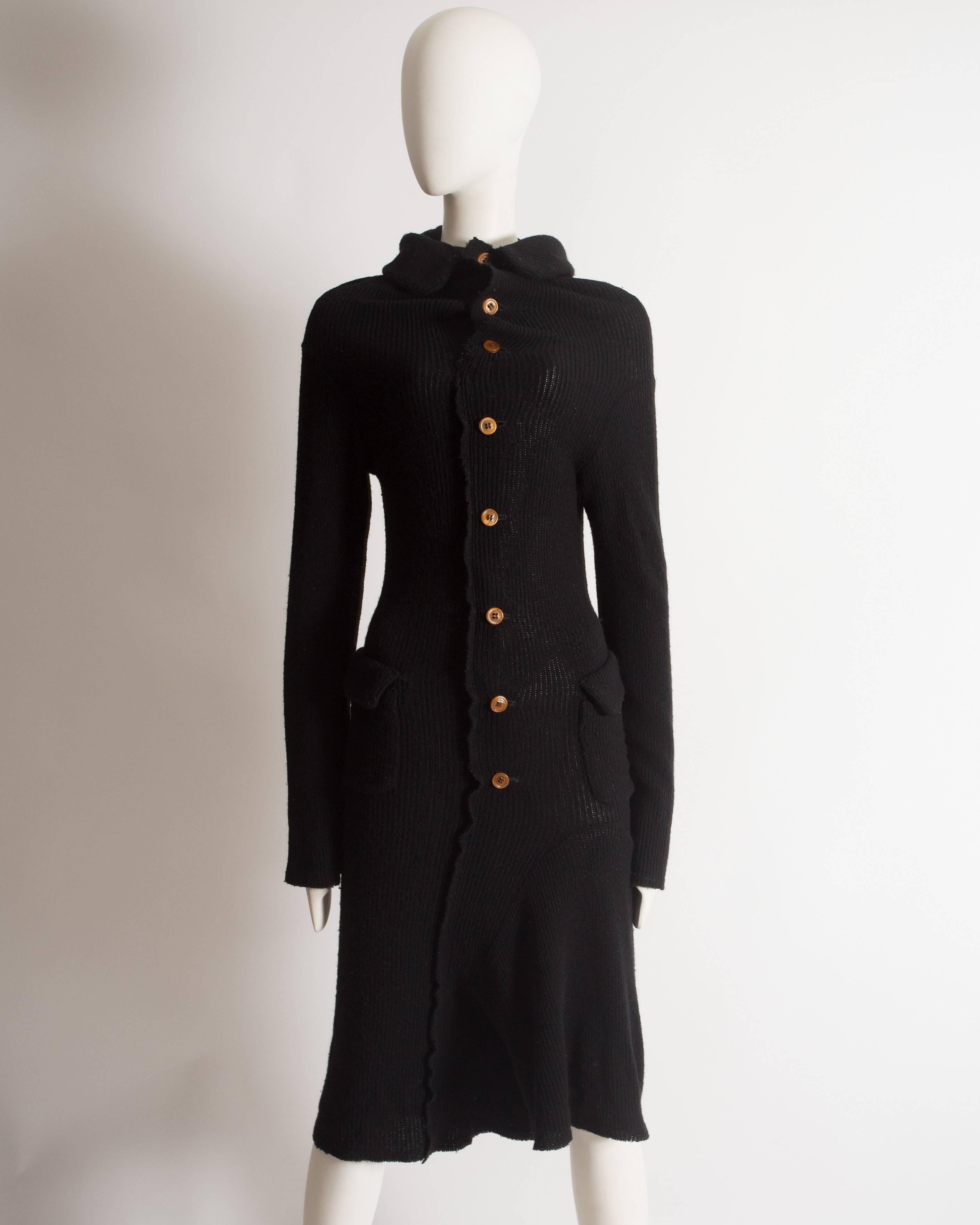 Comme des Garcons black wool deconstructed playsuit.

Autumn-Winter 2002

Medium