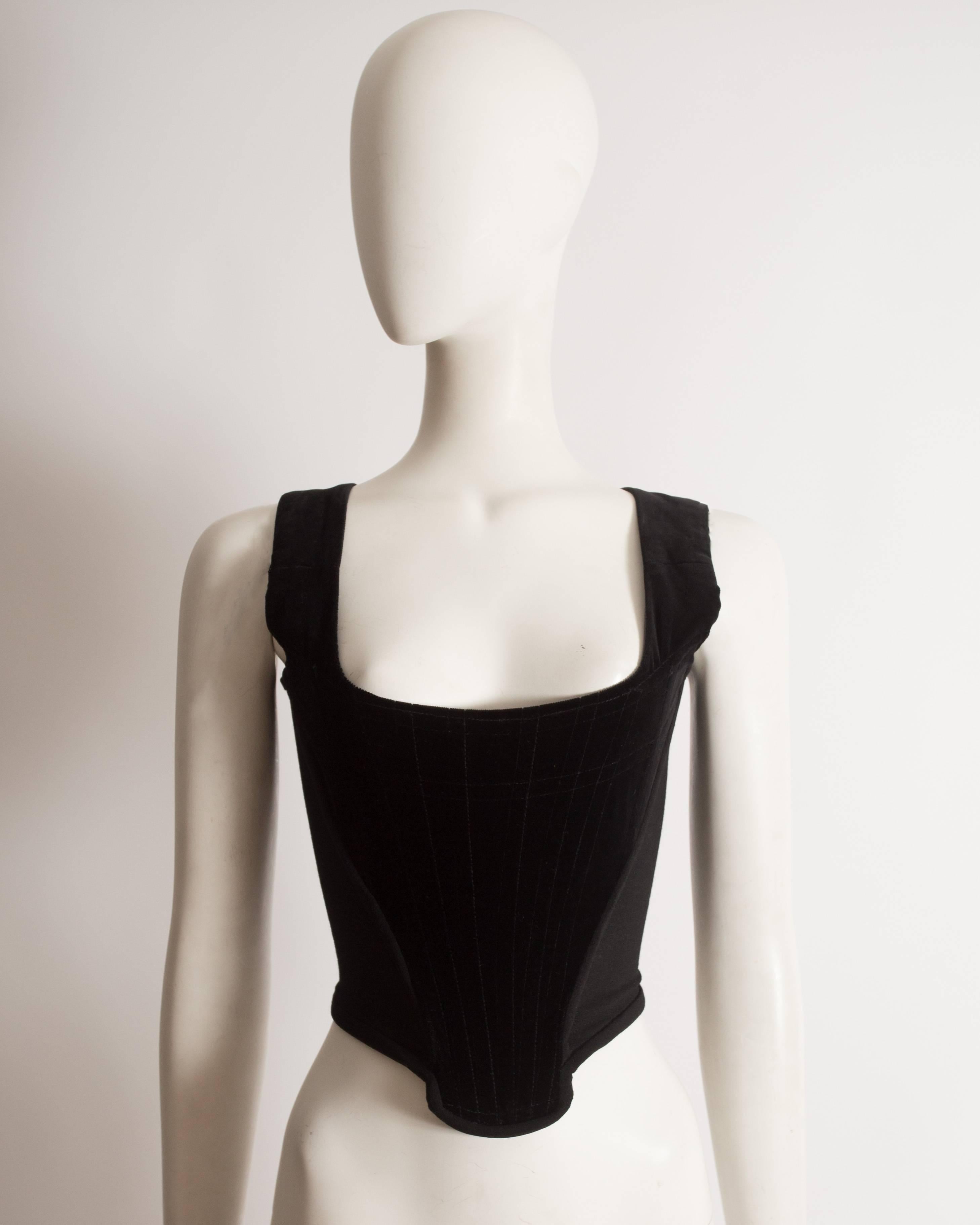 Vivienne Westwood black velvet corset with wool side panels and internal boning.

Autumn-Winter 1993