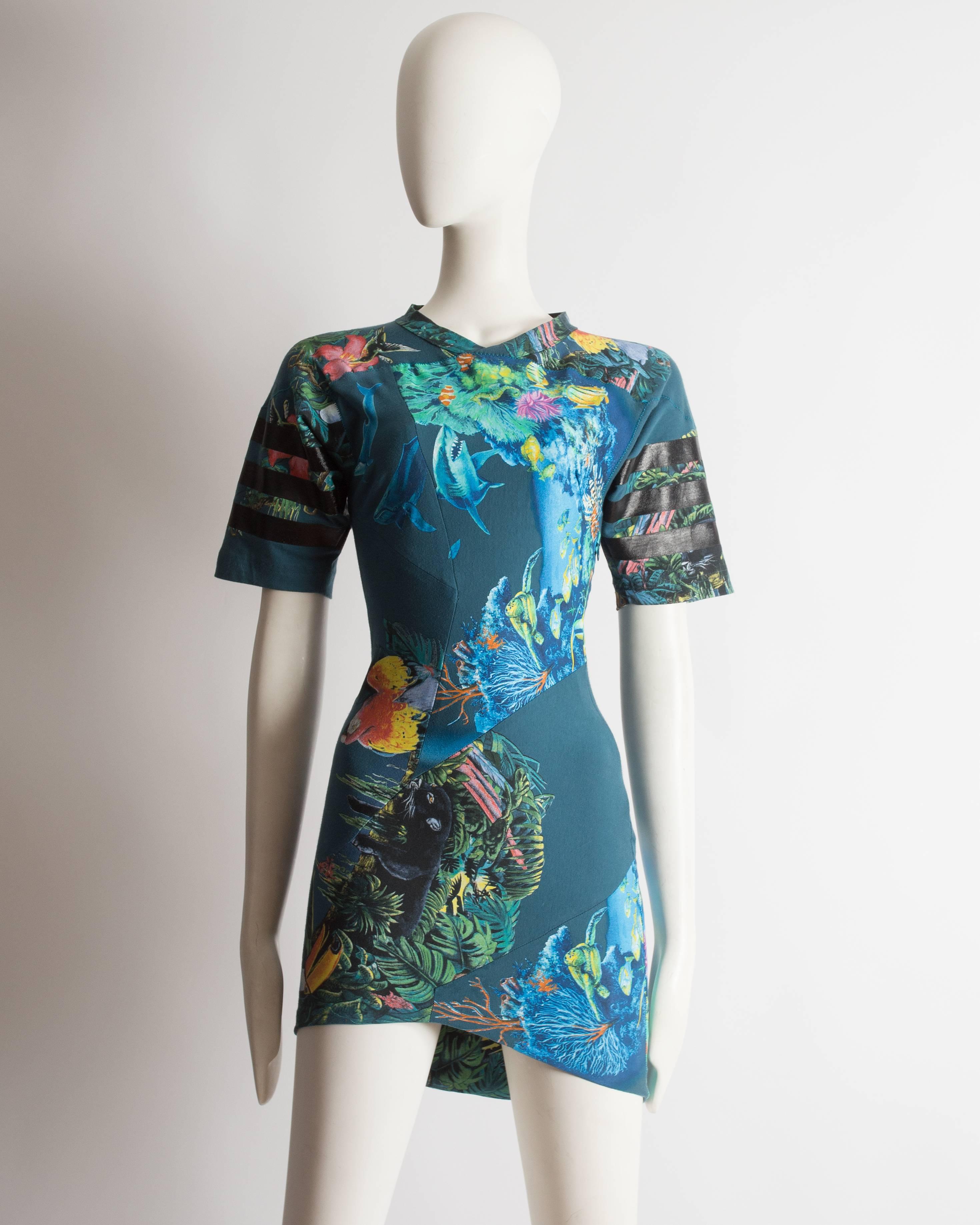 Important Balenciaga by Nicolas Ghesquiere scuba mini dress, Spring-Summer 2003. Constructed in teal cotton with aquatic and jungle print throughout, zip closure and wide-cut short sleeves. 