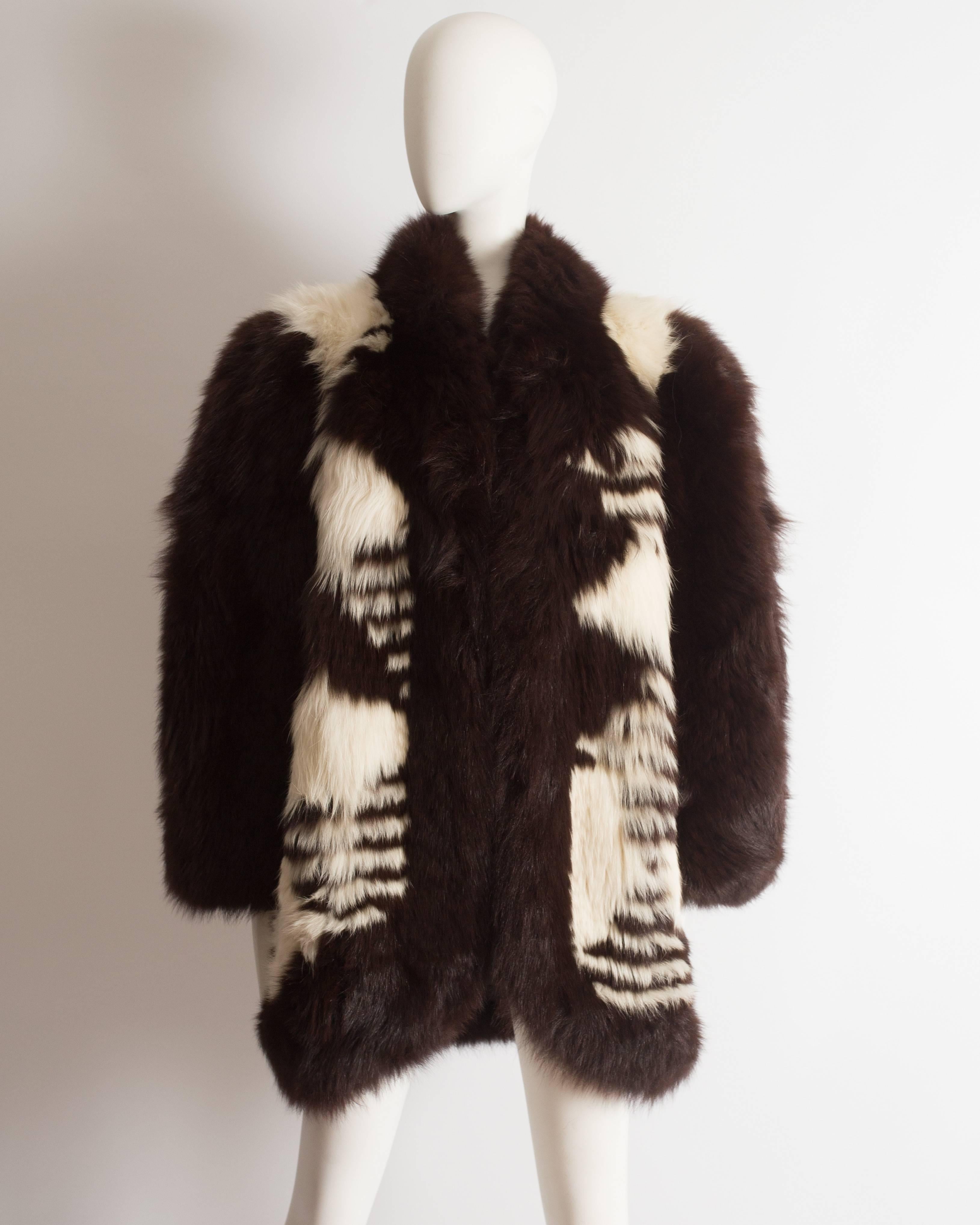 Presenting an exquisite Yves Saint Laurent oversized wild fox coat, a rare and luxurious piece from the 1980s. This coat exemplifies the brand's commitment to luxury and high fashion.

With its exaggerated shoulders, the coat exudes a sense of drama