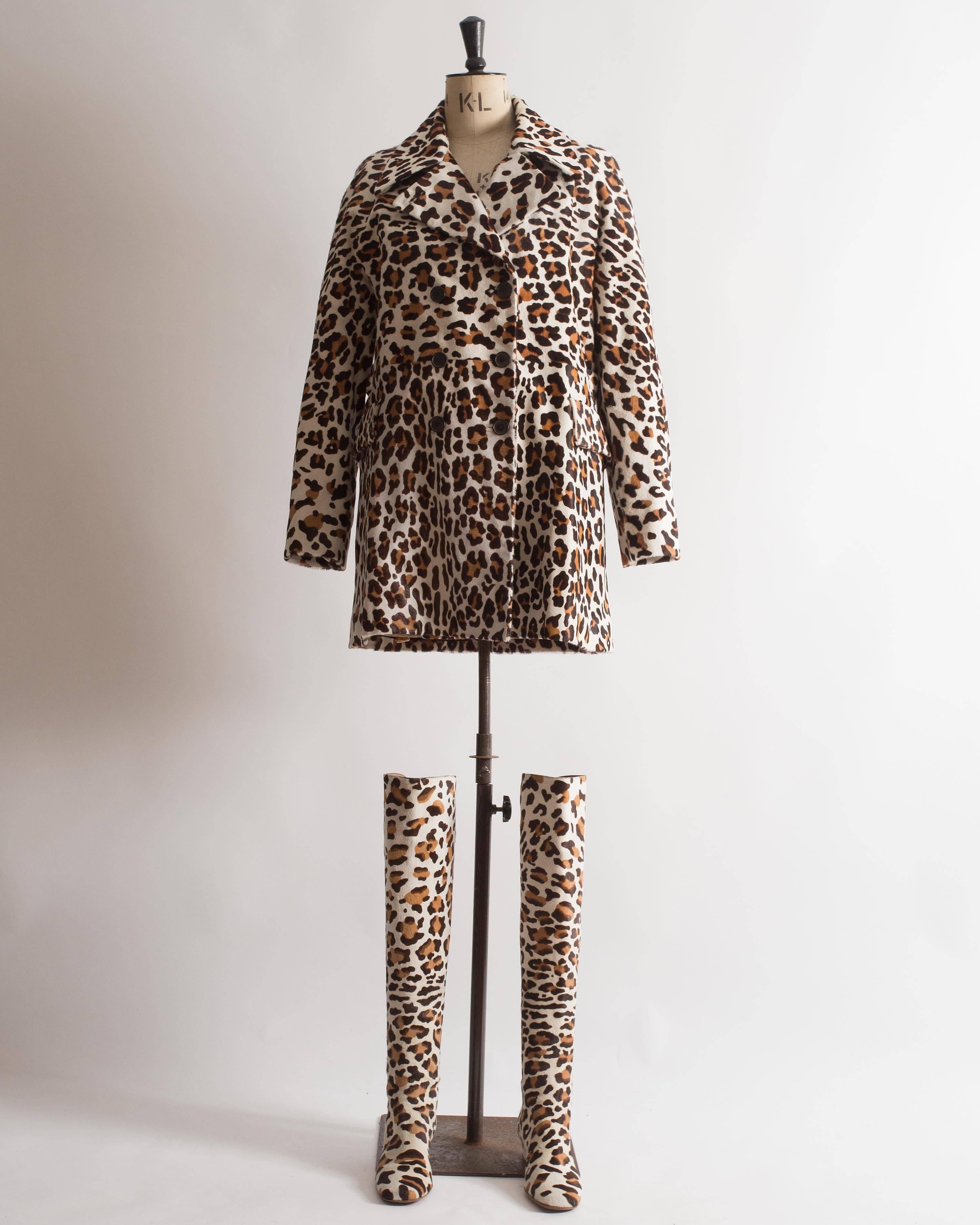 Introducing an extraordinary Alaia pony hair leopard print coat and boots ensemble, a true statement of bold and luxurious style. This ensemble showcases the brand's impeccable tailoring and daring design.

The coat features a notch collar, adding a