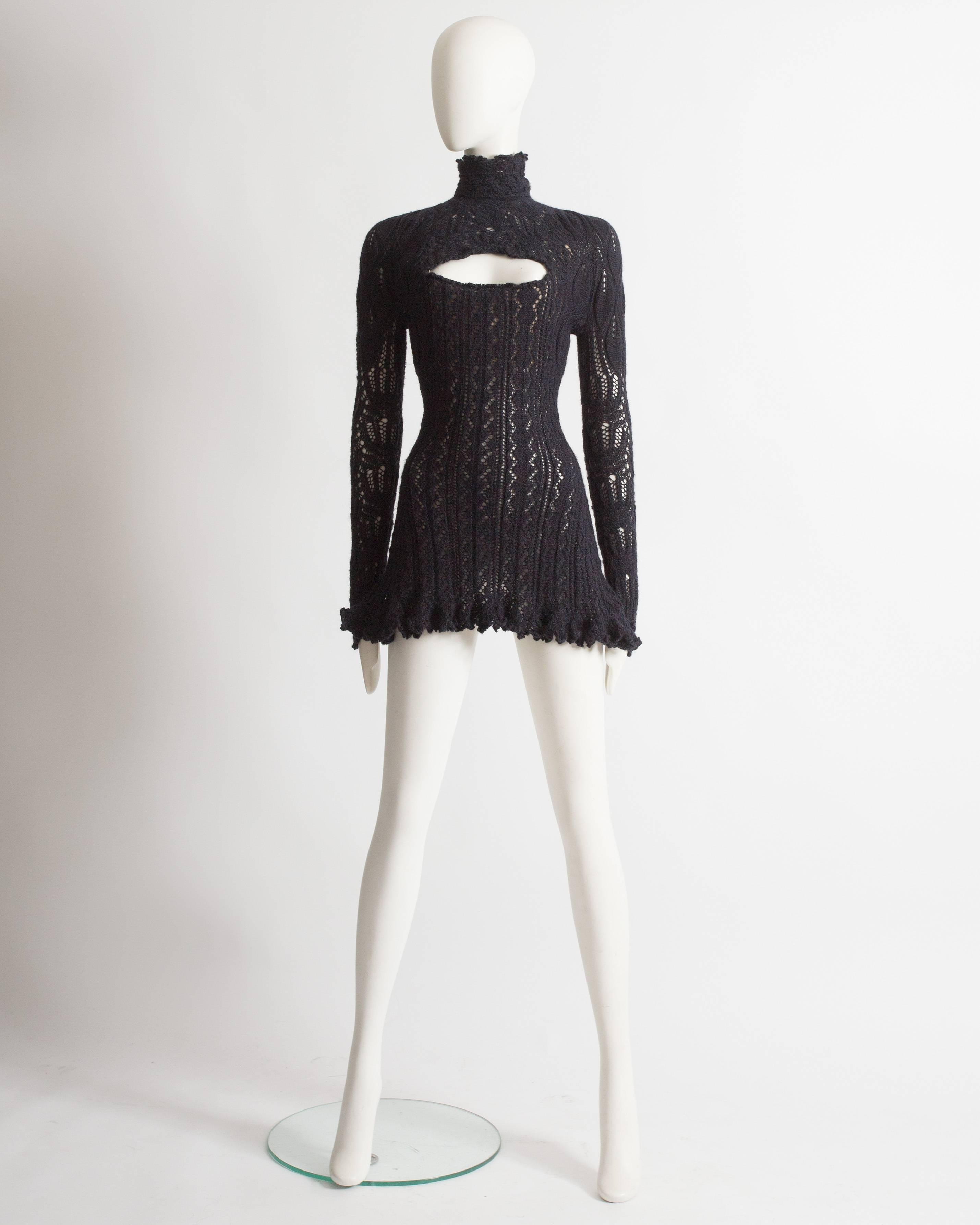 Rare Vivienne Westwood crochet knit mini dress. Internal corset with boning, scalloped hem on the skirt, and collar, cutout on the bust and zip closure at the rear.

Autumn-Winter 1993