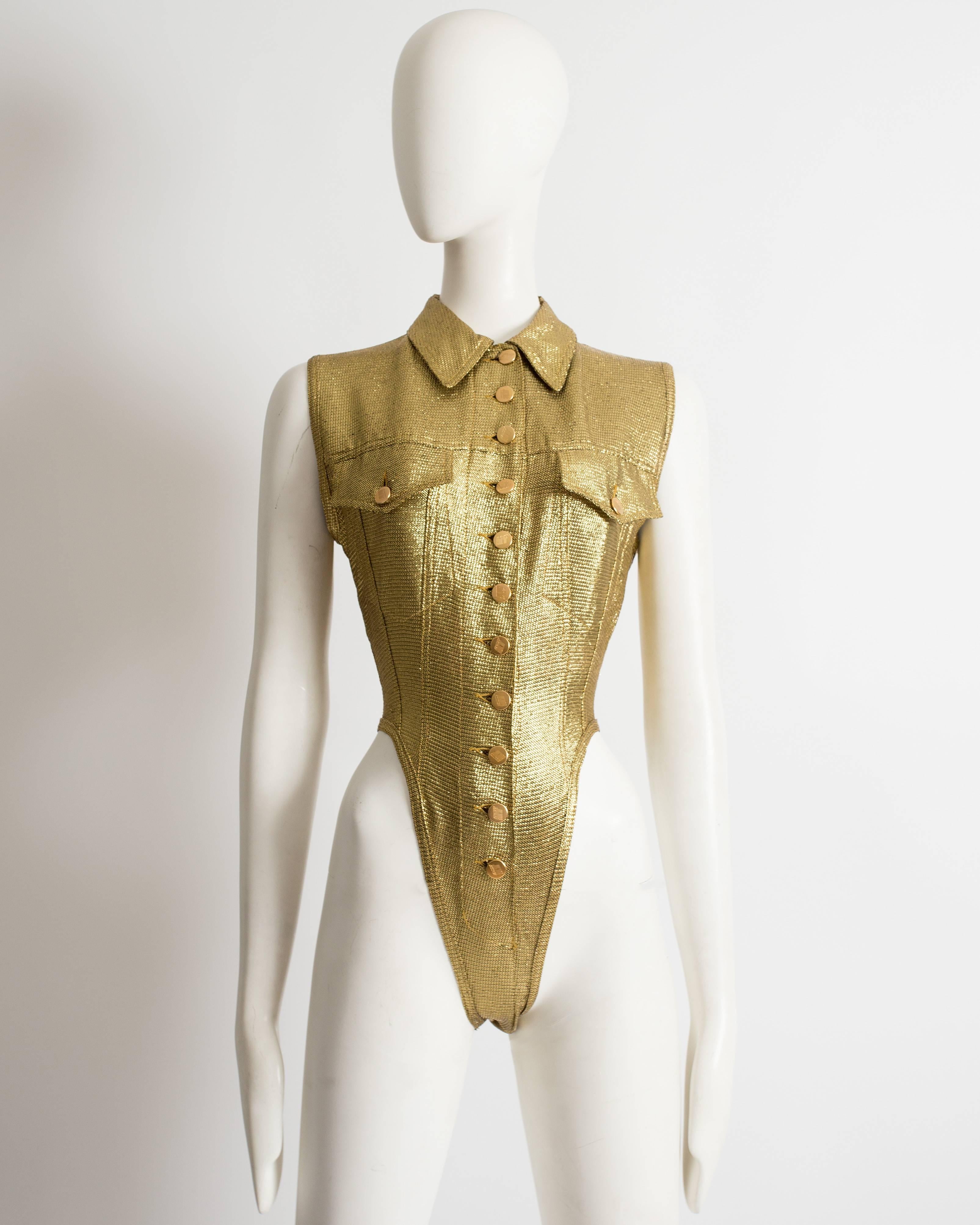 Jean Paul Gaultier, 'Junior Gaultier' metallic gold lurex leotard, Spring-Summer 1989. Classic collar, two chest pockets and a front button fastening.
