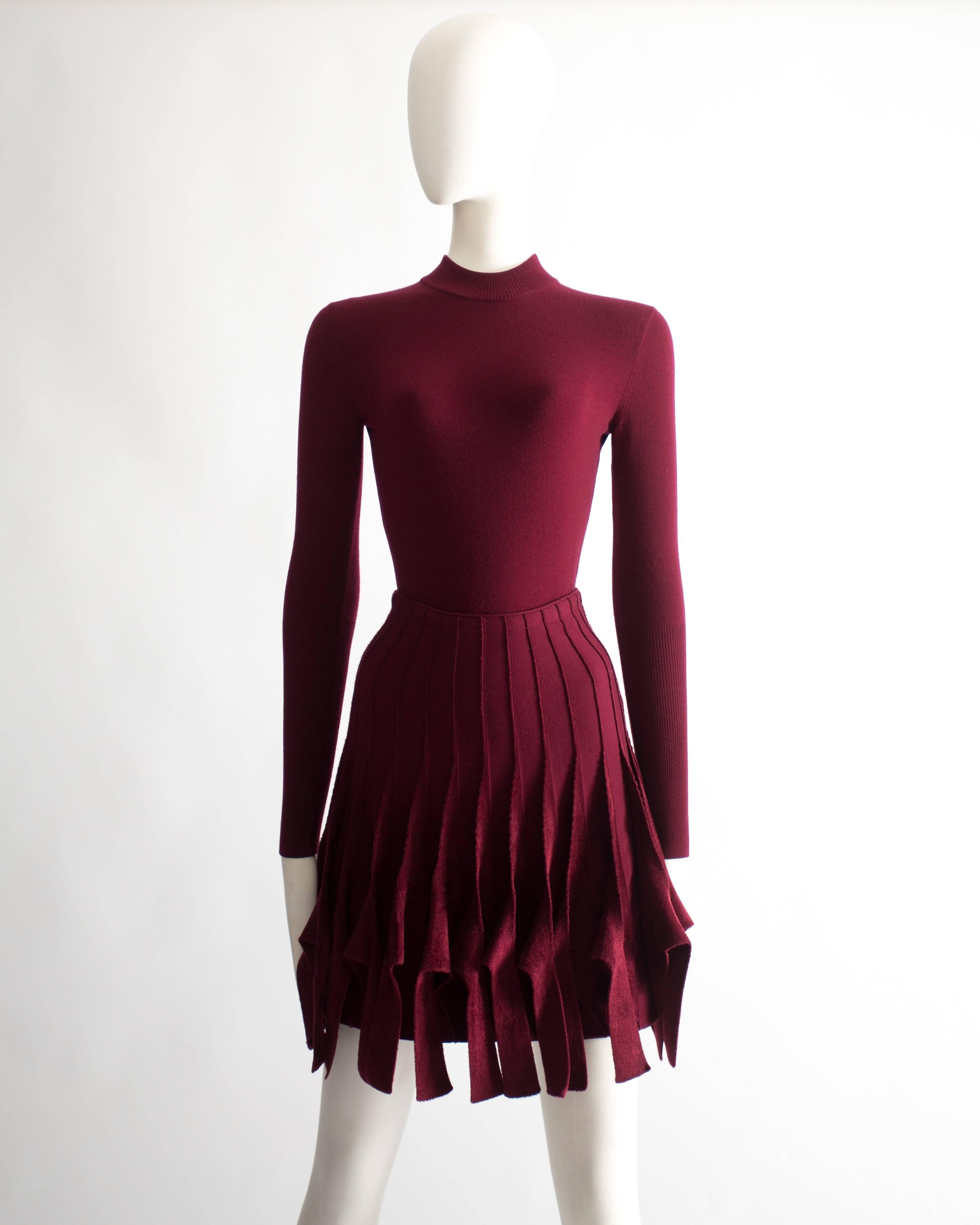 Alaia ensemble. Wool body with turtle neck and long fitted sleeves and wool fringed skirt with chenille panels. 