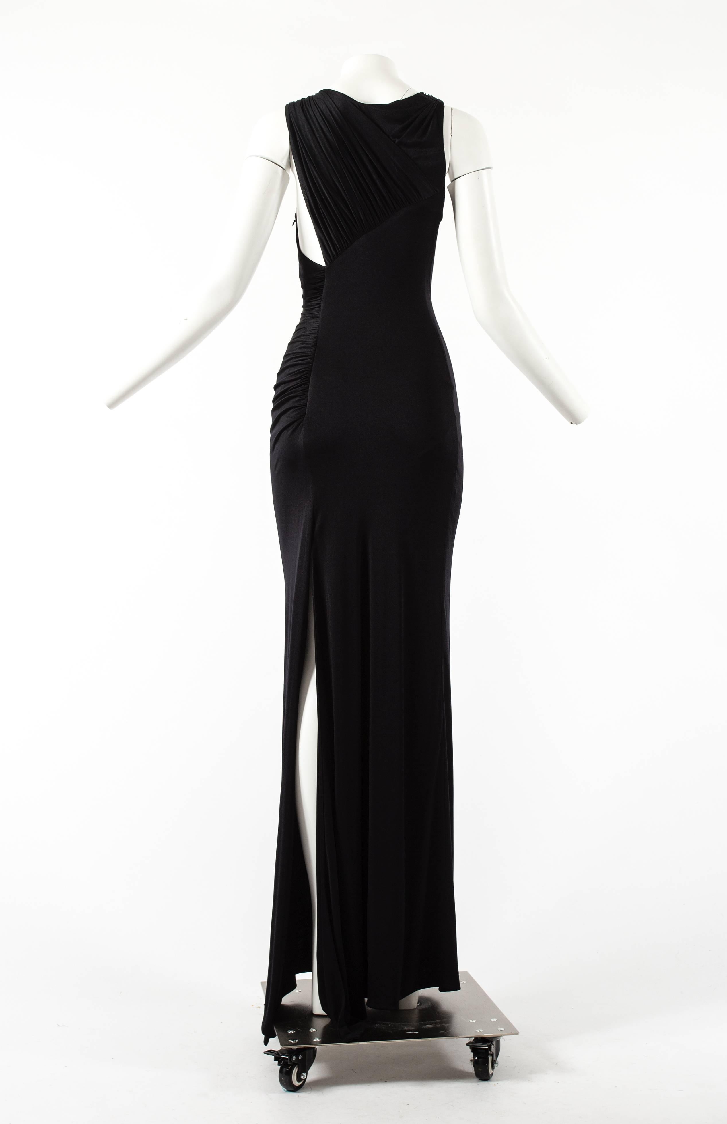 Gianni Versace Spring-Summer 2001 black jersey bodycon evening dress

- high leg slit 
- internal mesh body 
- zip fastening on side seam
- asymmetric pleating and draping throughout 
- stretch spandex jersey