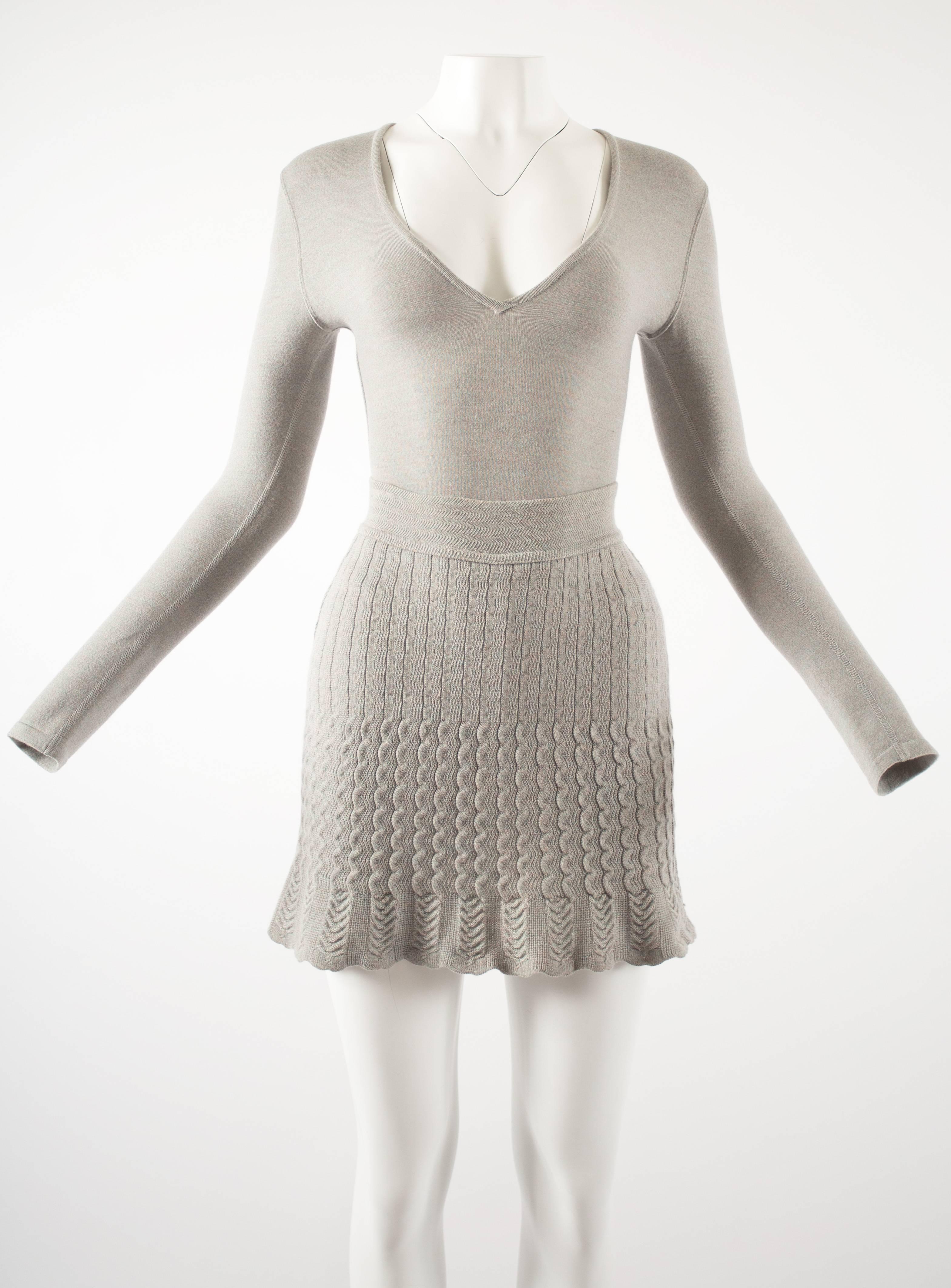 Alaia 1990s dove grey knitted bodysuit and mini skirt ensemble 

- high rise body suit with long fitted sleeves, snap button fastening and zip closure
- high waisted flared mini skirt with attached mini shorts inside