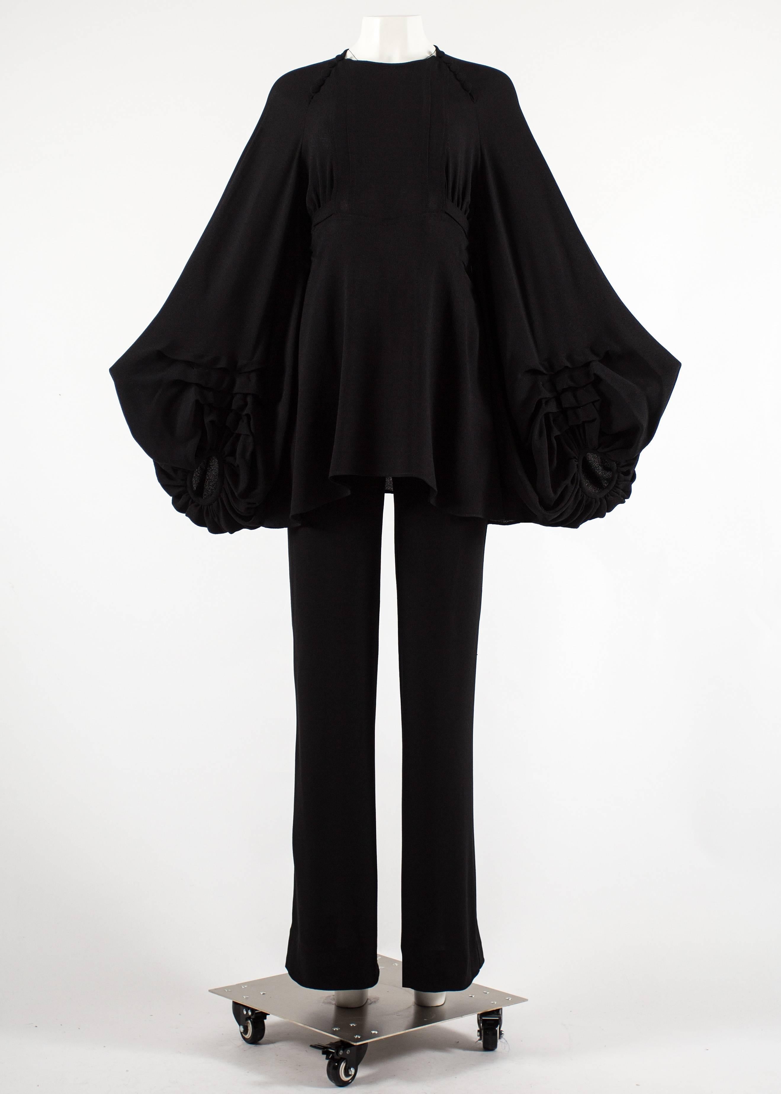Ossie Clark 1970 black moss crepe pant suit 

- blouse with huge billowing sleeves, waist belt, button fastenings and zip closure on side seam

- high rise straight leg pants