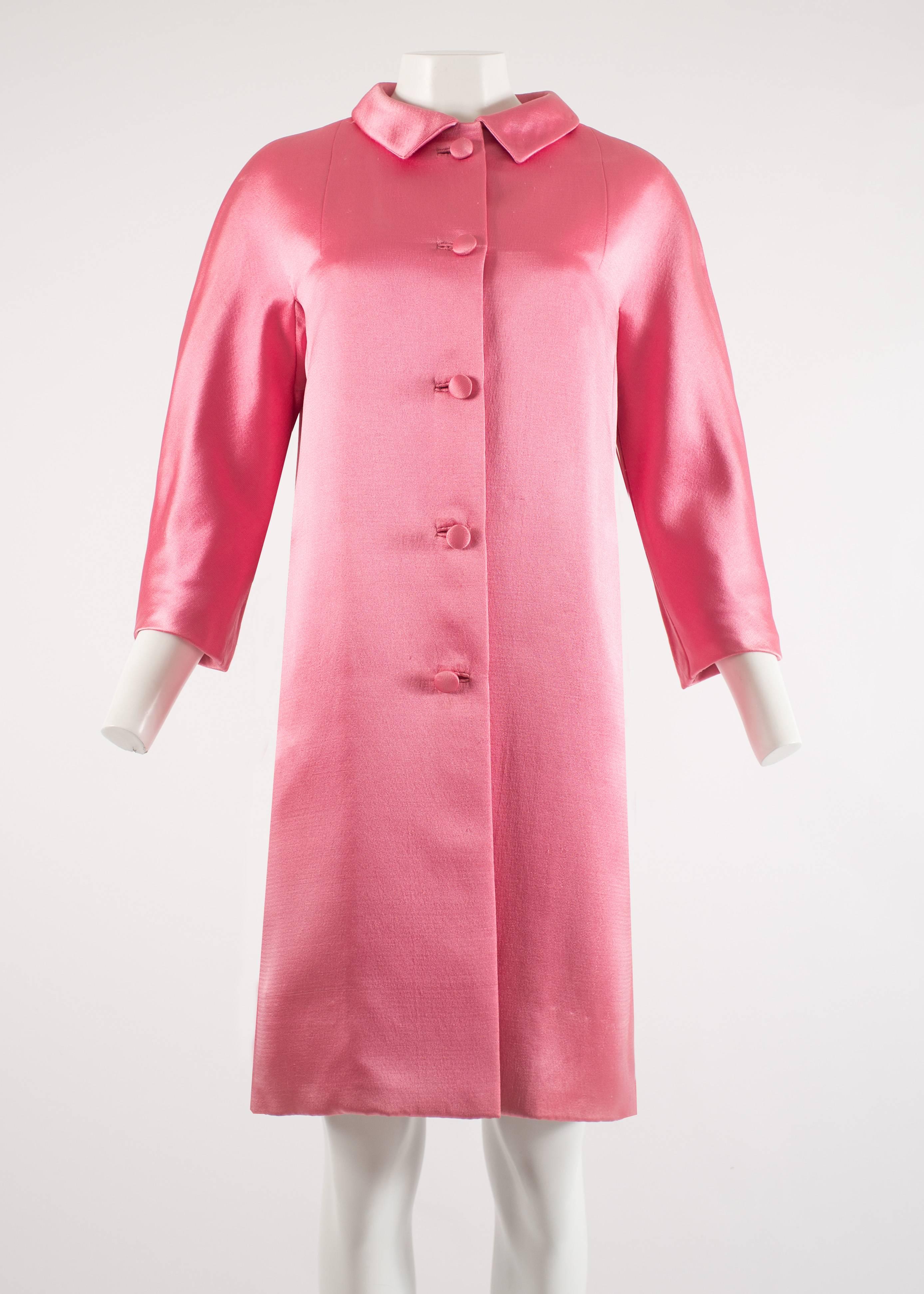Balenciaga 1963 Haute Couture hot pink silk evening coat

- EISA label
- five button closure fastening at the front
- three quarter length raglan sleeves
- finishing just above the knee
- black silk lining
- two side pockets